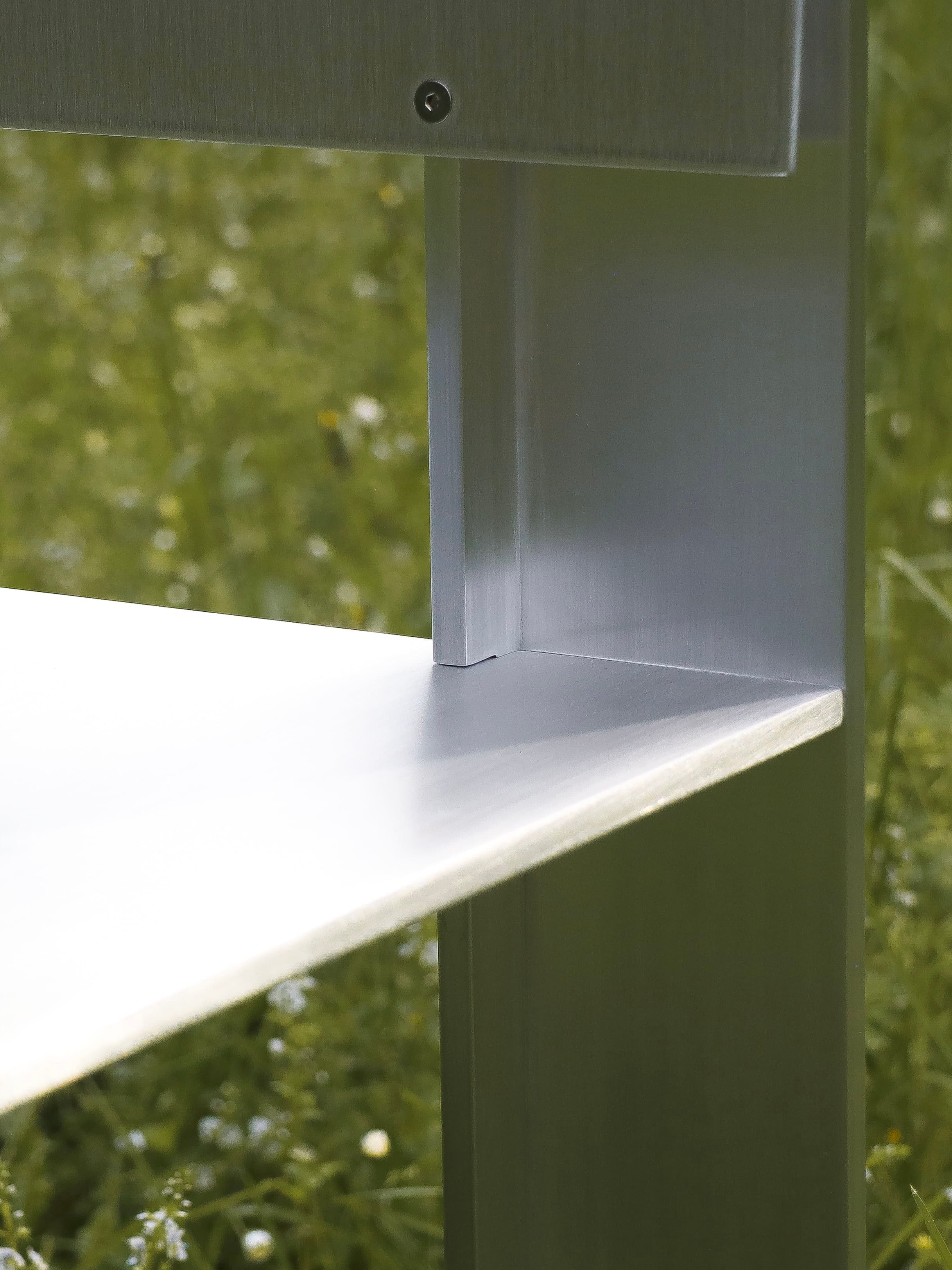 AL Chair — close-up of brushed aluminum corner detail