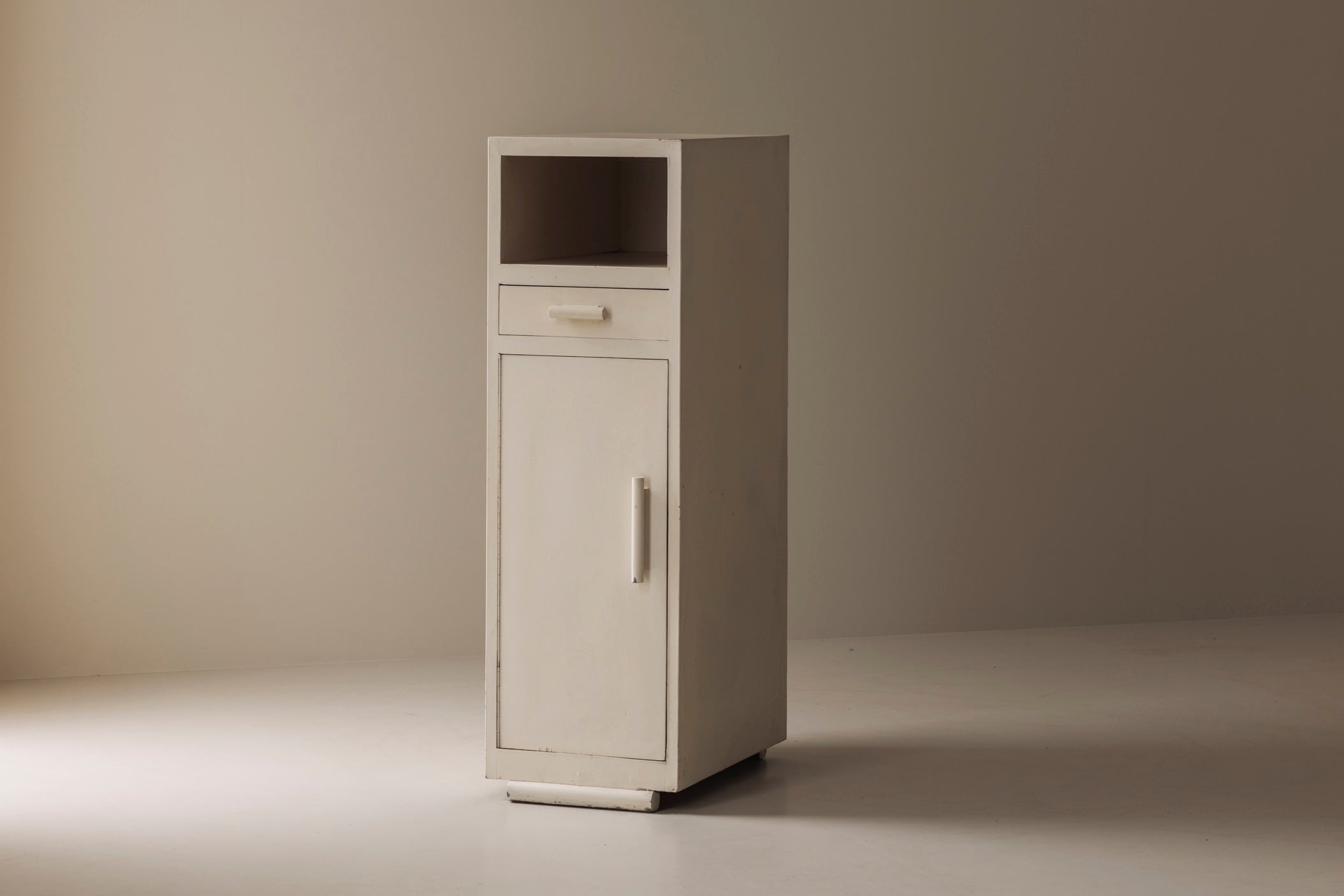 Elegant Modernist Cabinet from the 1930s — side angle showing white finish and minimalist design