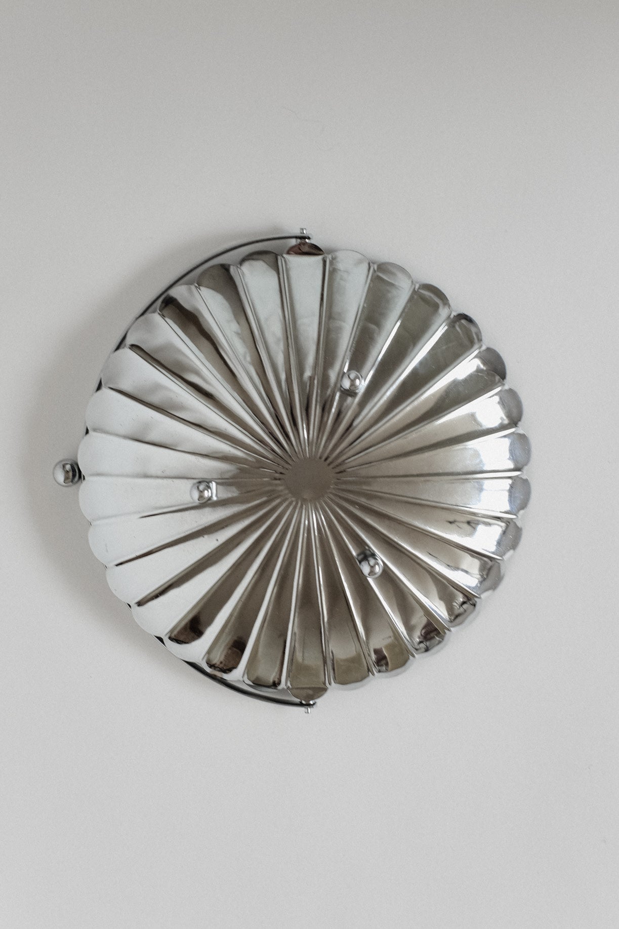 Serving Dish With Handle — top view of polished metal surface