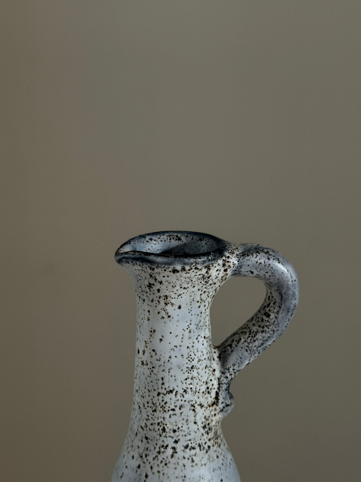 Small handled pitcher by Jacques Pouchain, Dieulefit, France, circa 1960.  — lifestyle setting
