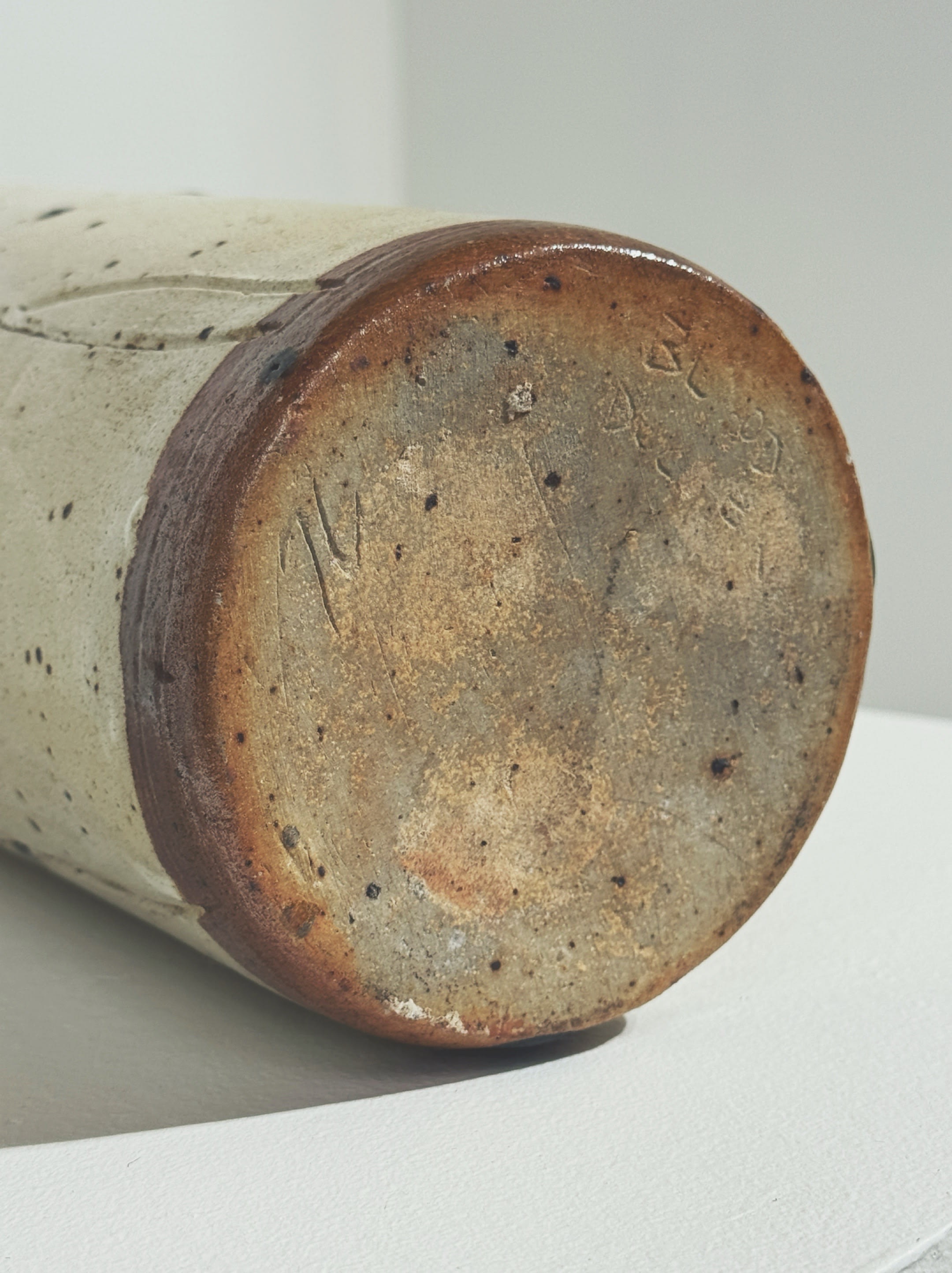 Bottom view showing textured stoneware surface of French vintage vase