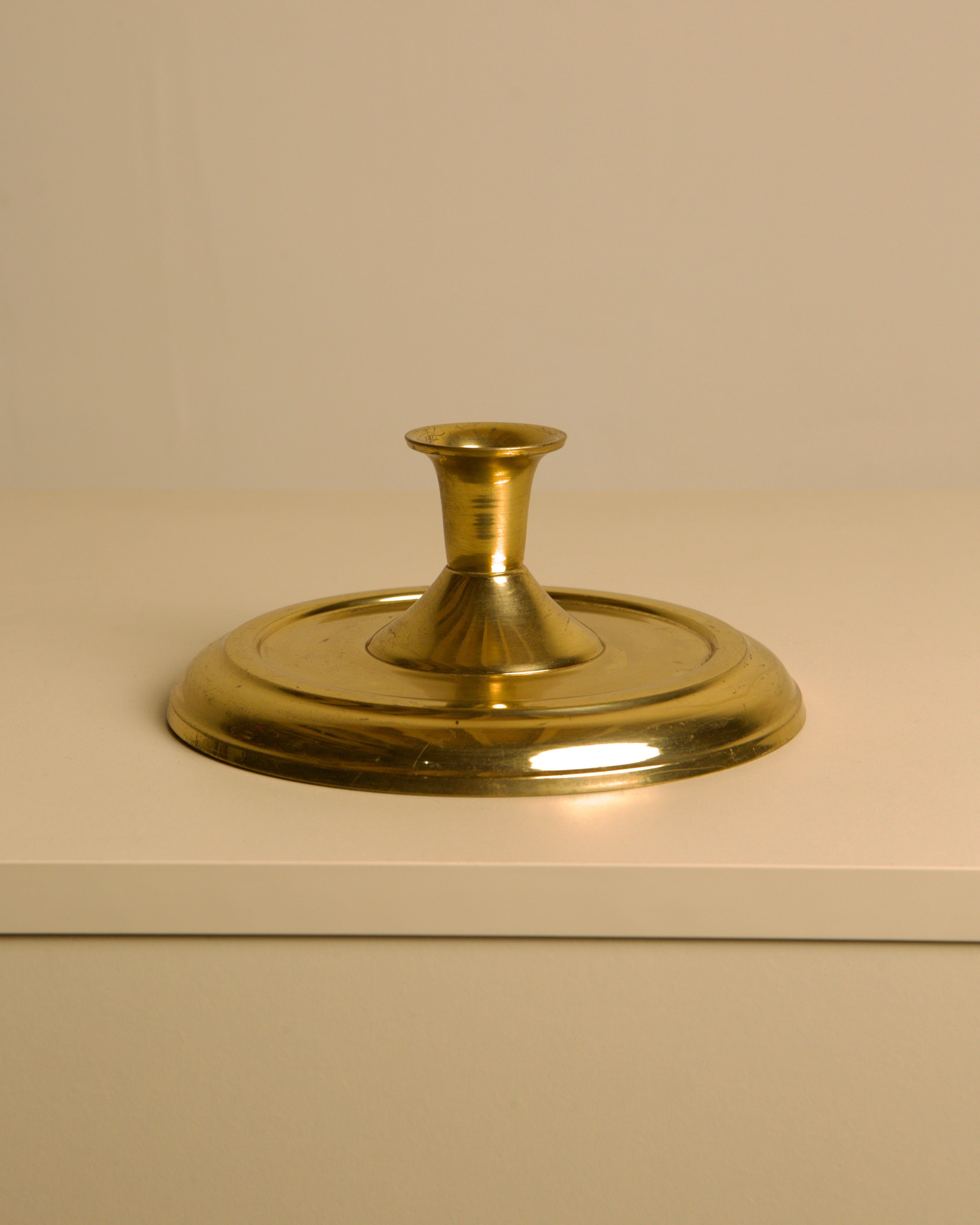 Circular Candleholder in Gold Metal 60's — close-up of polished gold surface