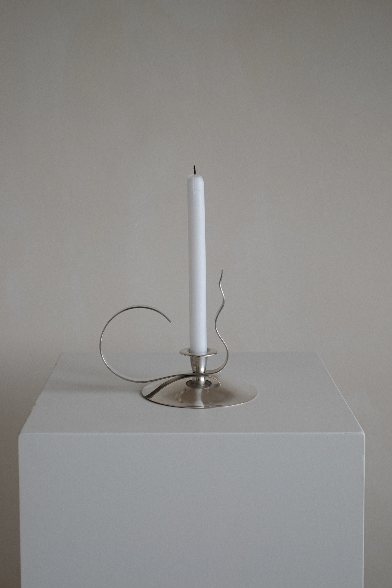Silver-Plated Candle Holder — angled view on white pedestal