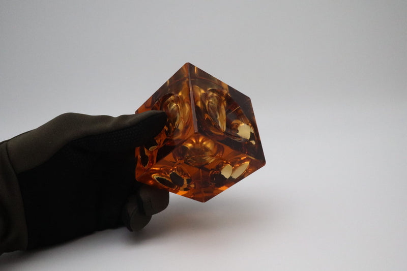 Lighter by Antonio Imperatore, orange murano glass, Italy, 1970 — close-up of glass detail held in gloved hand