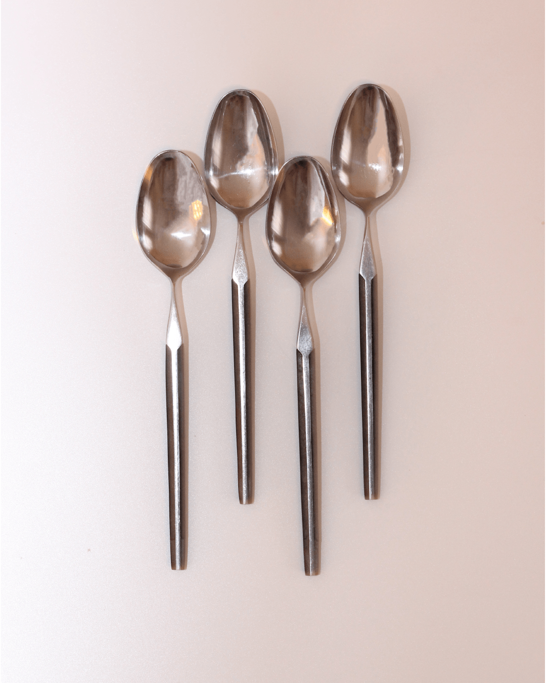 Mid-Century Cutlery — top view of stainless steel spoons