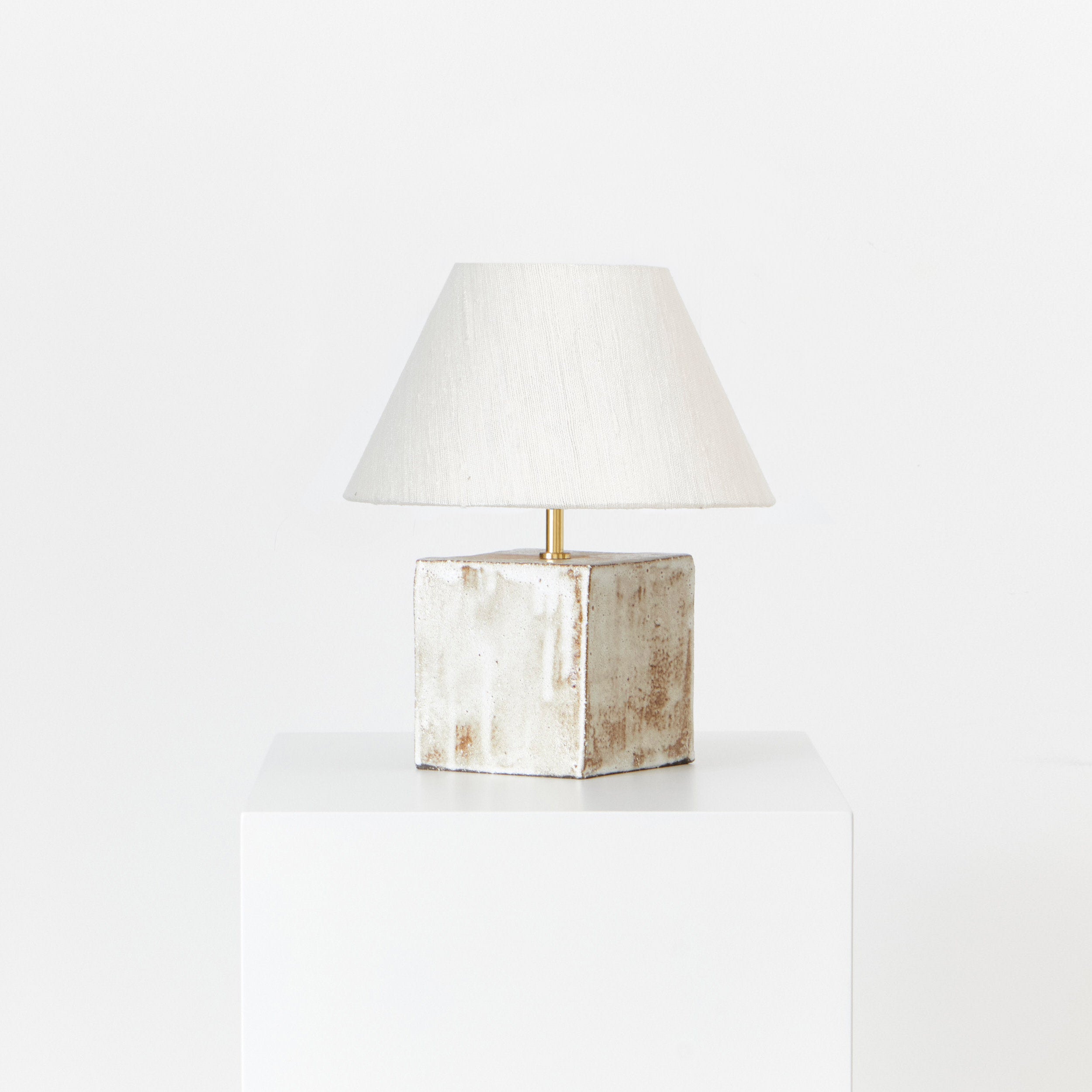 Arouca Table Light White — front view of textured ceramic base