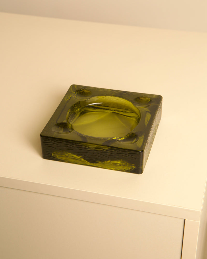 Dark green glass Italian ashtray detail showing thick geometric form