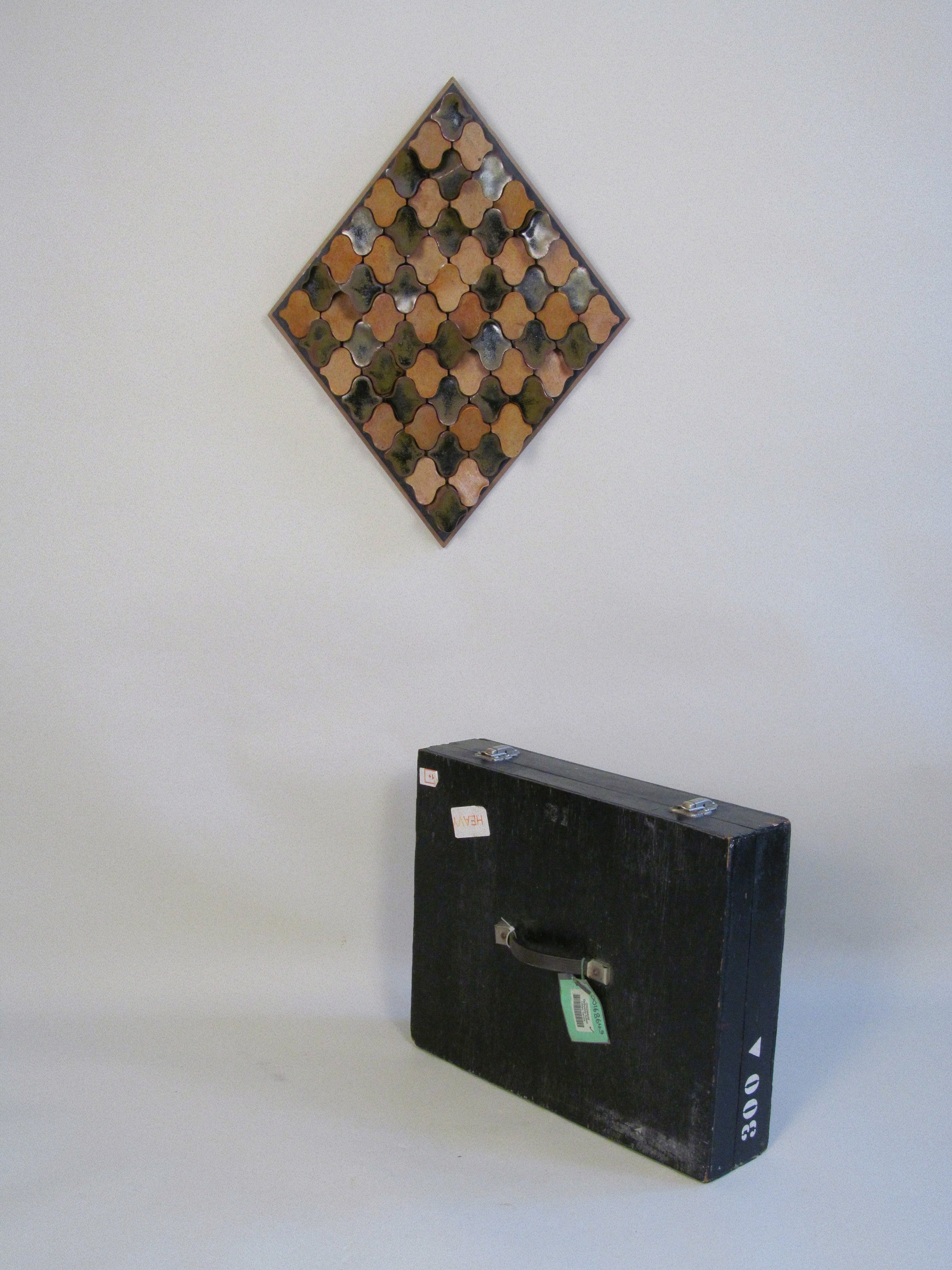 Derbyshire School of Art Ceramic Wall Plaque with Original Case c.1970 — displayed above vintage black case on neutral backgr