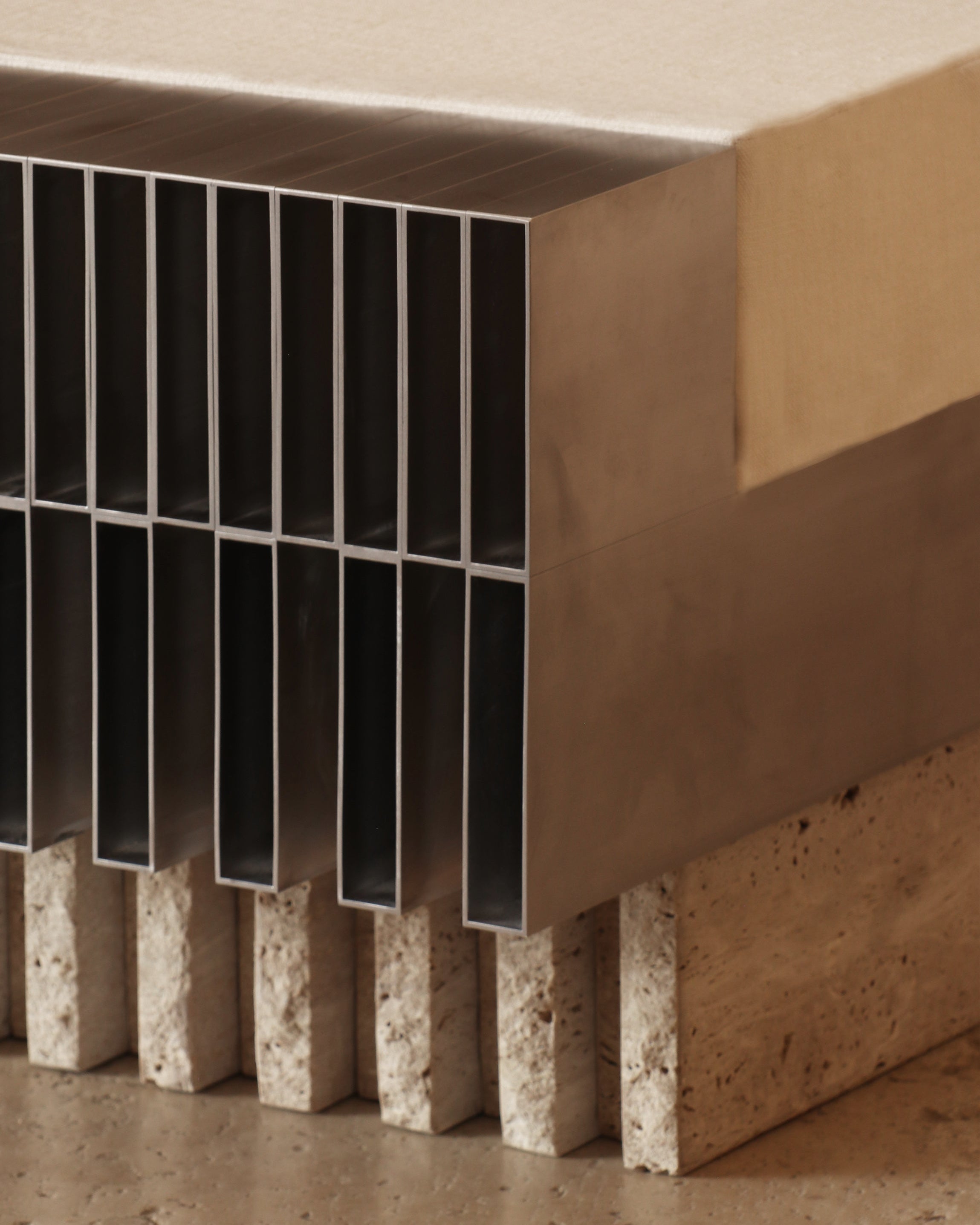 Modern piano ottoman with vertical black slats and stone base detail