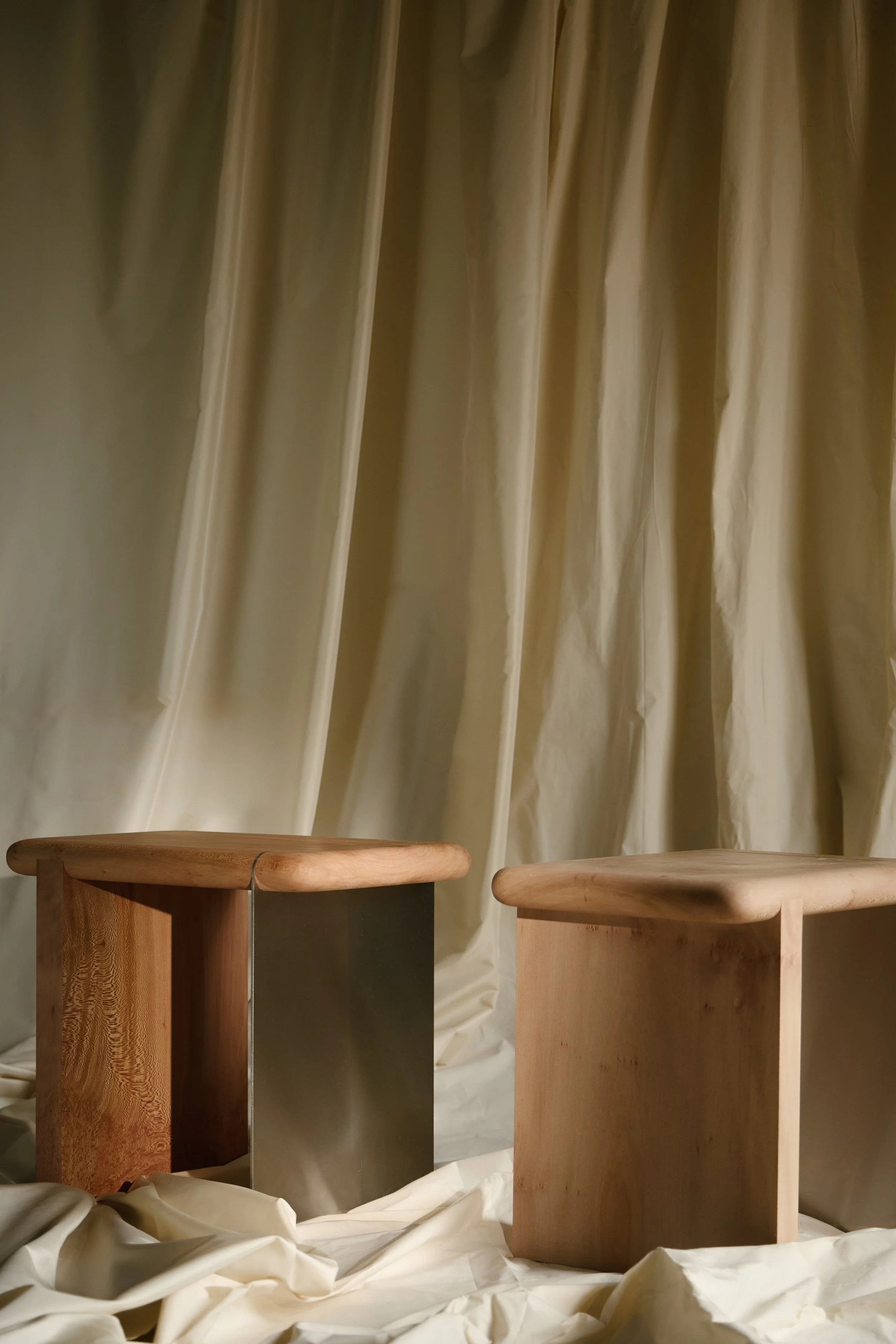The Ferro Side Table — top view of wooden surface and metal base