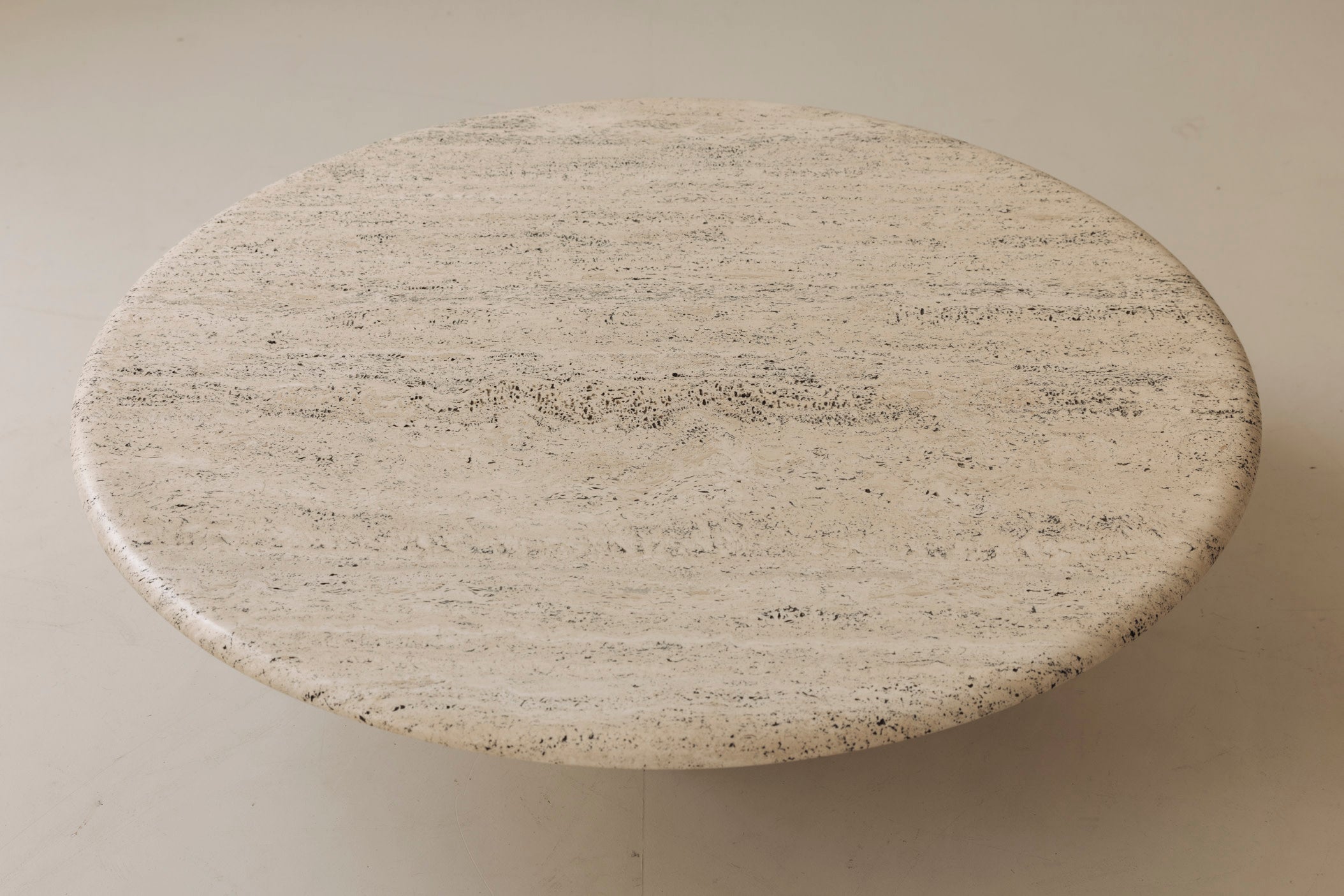 Travertine round coffee table by Angelo Mangiarotti, Italy 1970s — lifestyle setting