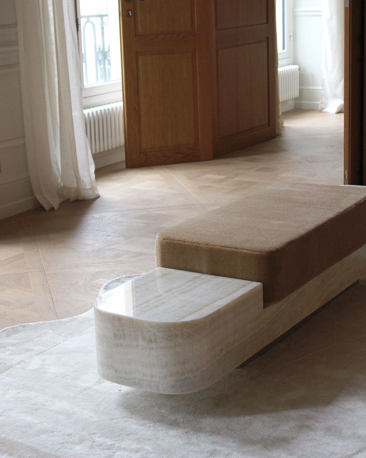 Ran Ivory Onyx Bench — top view showing smooth onyx surface and plush cushion