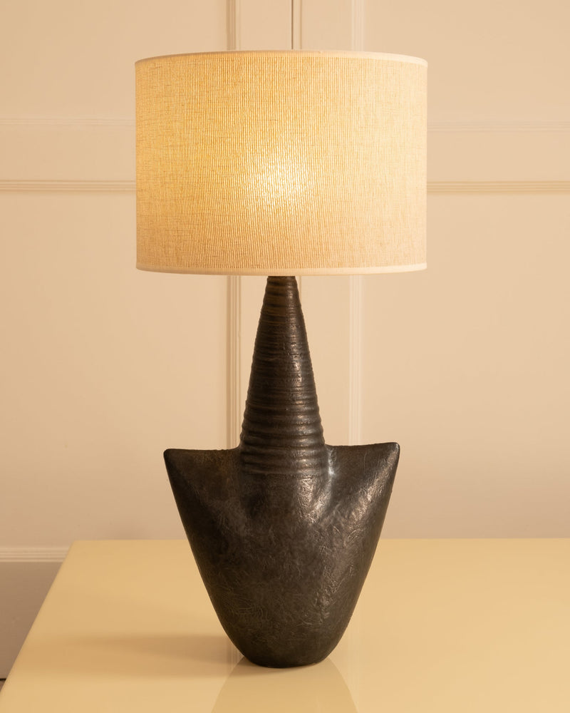 Dark ceramic table lamp with ribbed cone neck and textured finish