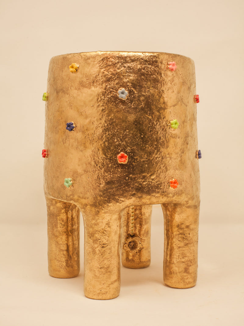 Gold cylindrical table lamp with colorful gemstone inlays and legs