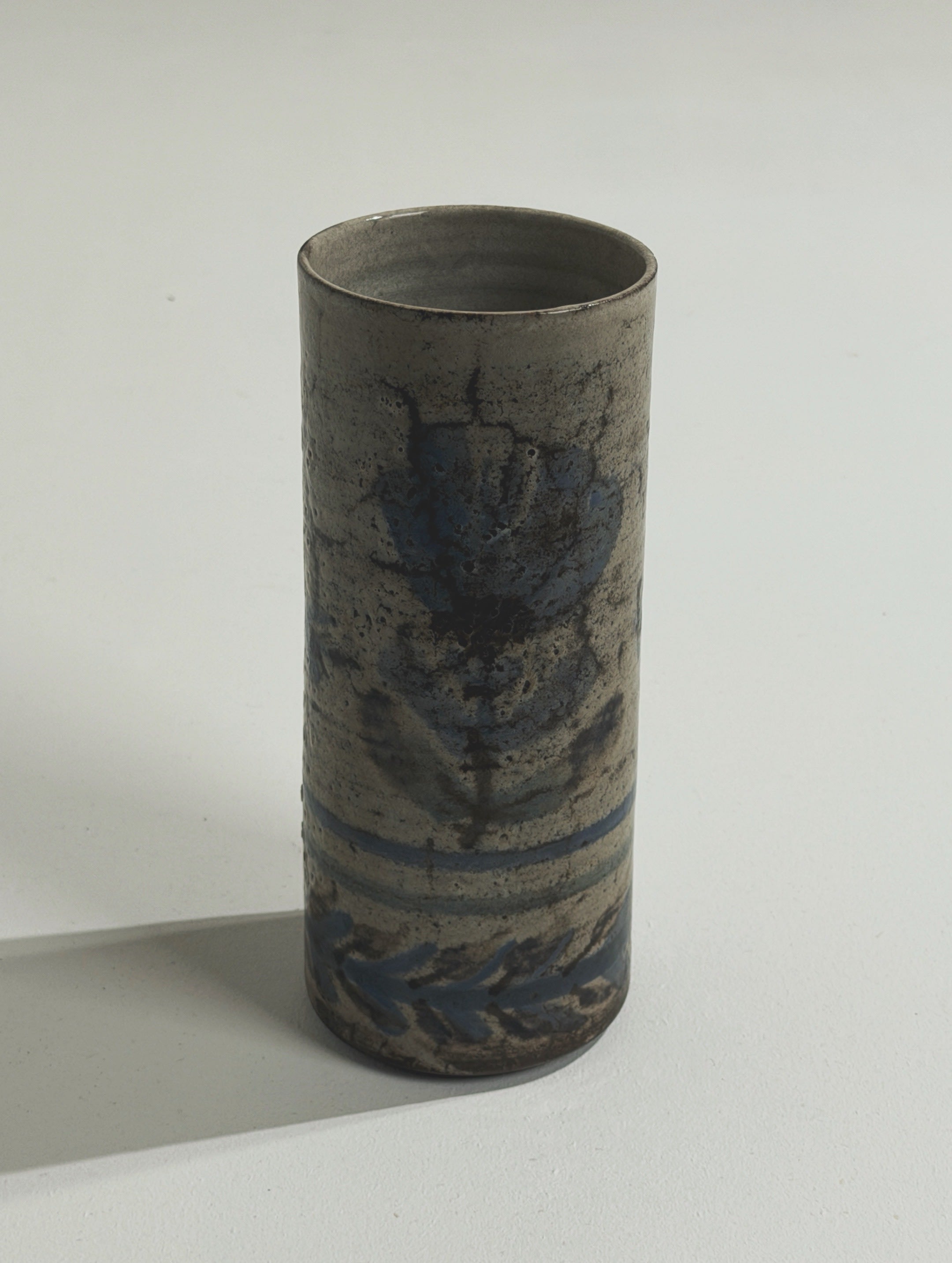Roller vase by Gustave Reynaud, Atelier Le Mûrier, Vallauris, circa 1960 — side angle highlighting ceramic texture and blue f