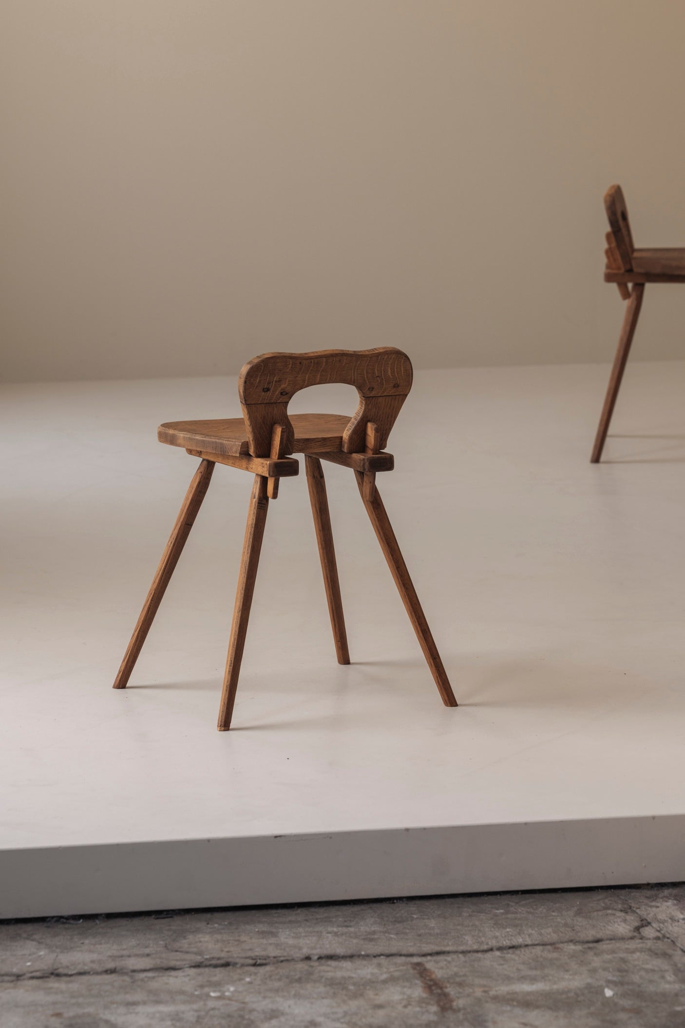 Sculptural pair of French solid oak side chairs from the 1950s — alternate view