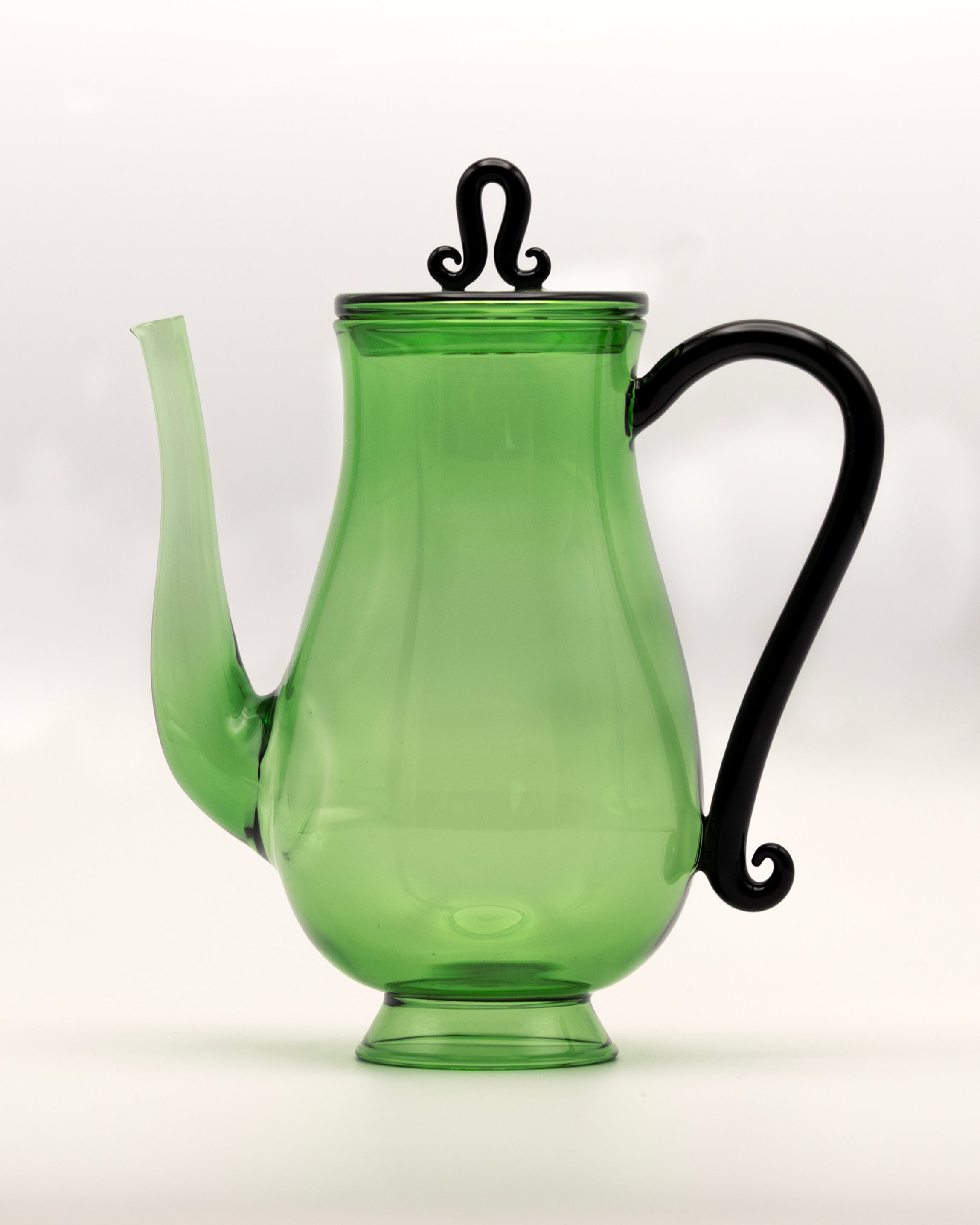 Bell Pot — side view of green glass teapot with black handle
