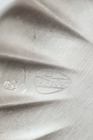 Silver-Plated Dish — top view showing engraved logo detail