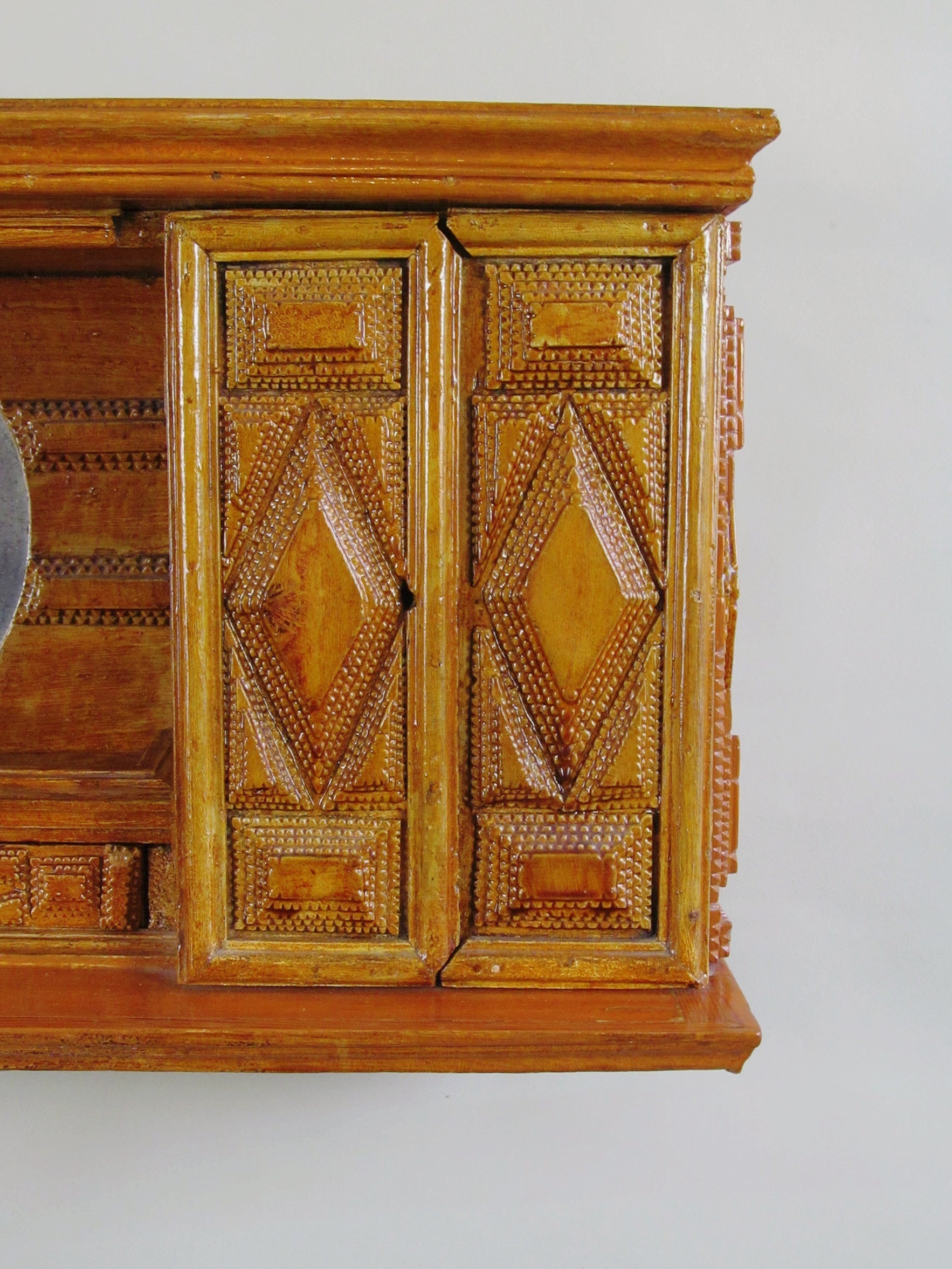 Tramp Art Wall Shelf 1890 - 1915 — close-up of handcrafted wooden cabinet doors