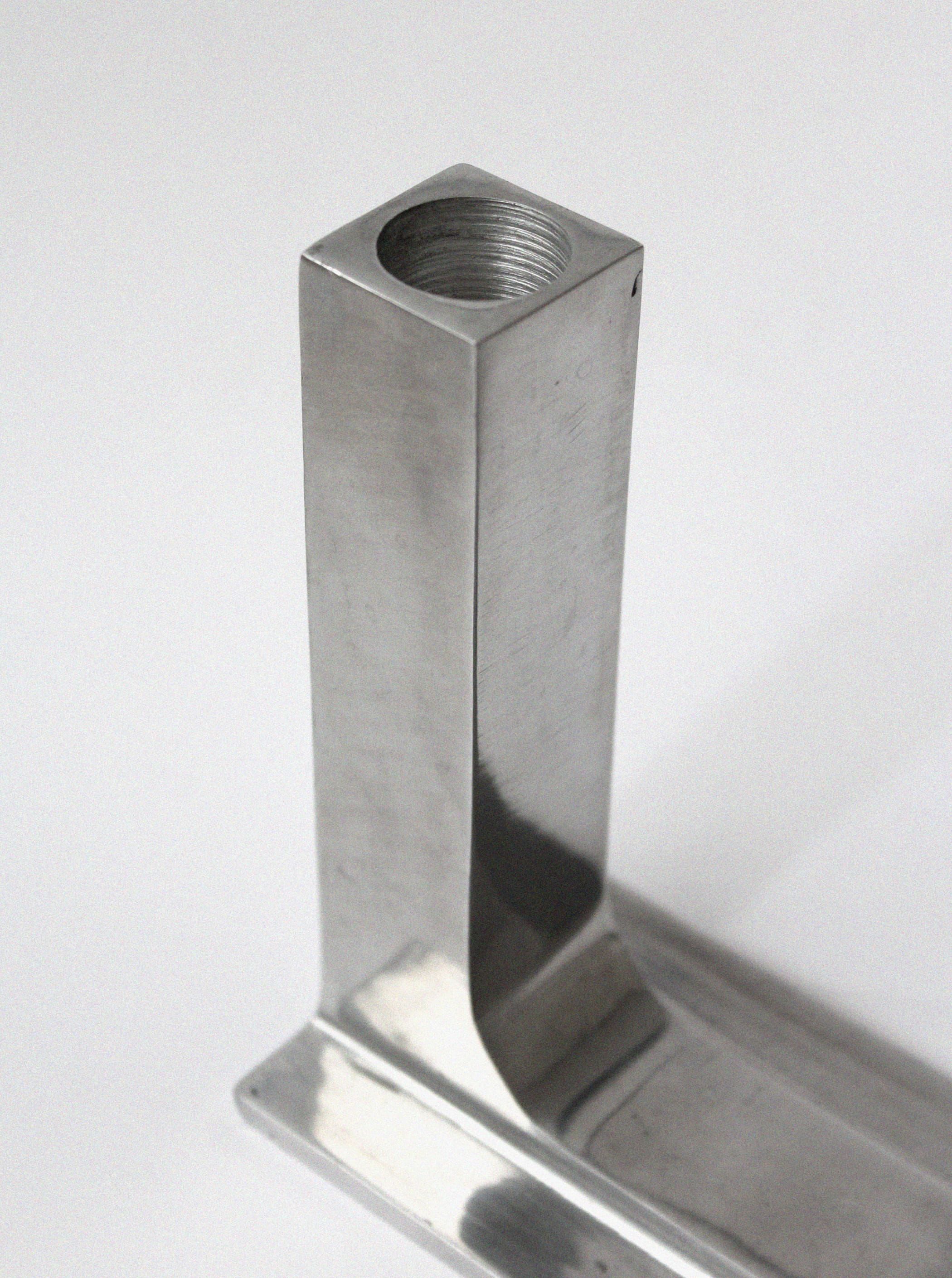 Brutalist aluminum candle holder showing threaded top detail