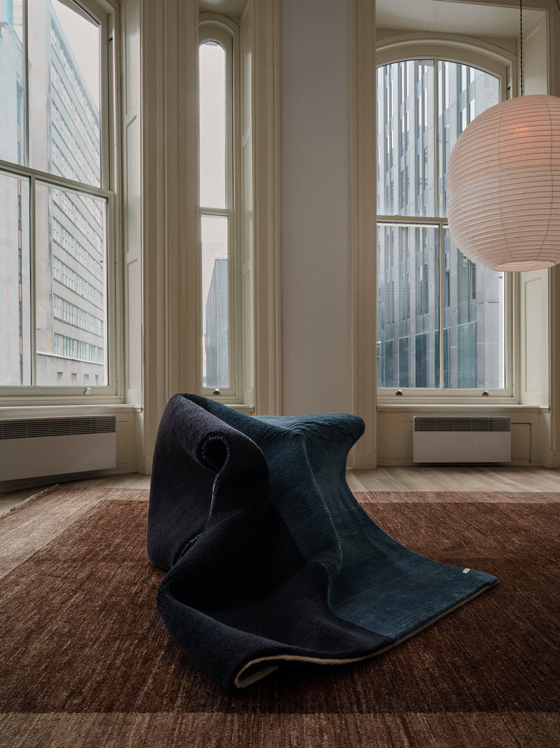 Gabbeh Rug in Cobalt 119 x 177 cm — close-up of folded rug in modern interior