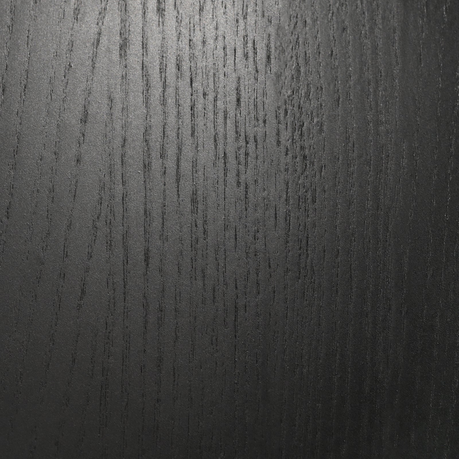 Elmyr Dining Table — close-up of black wood grain texture