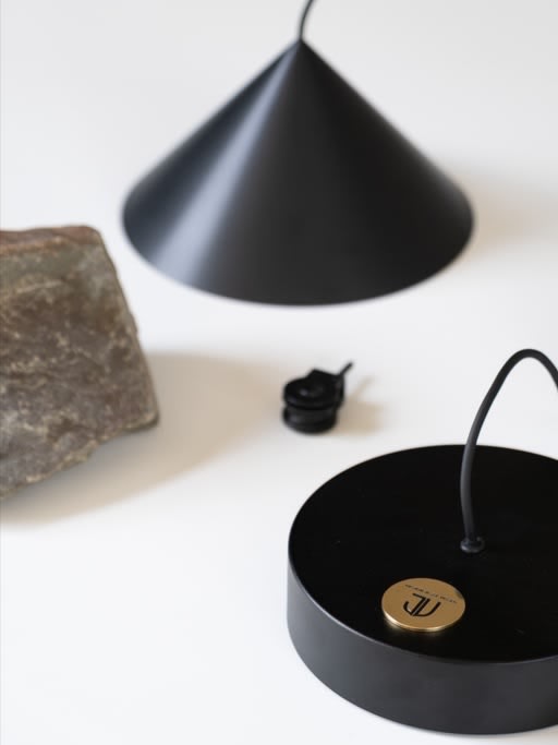 Pulse Light, single, dimmable lamp with a stone as a counterweight — in context