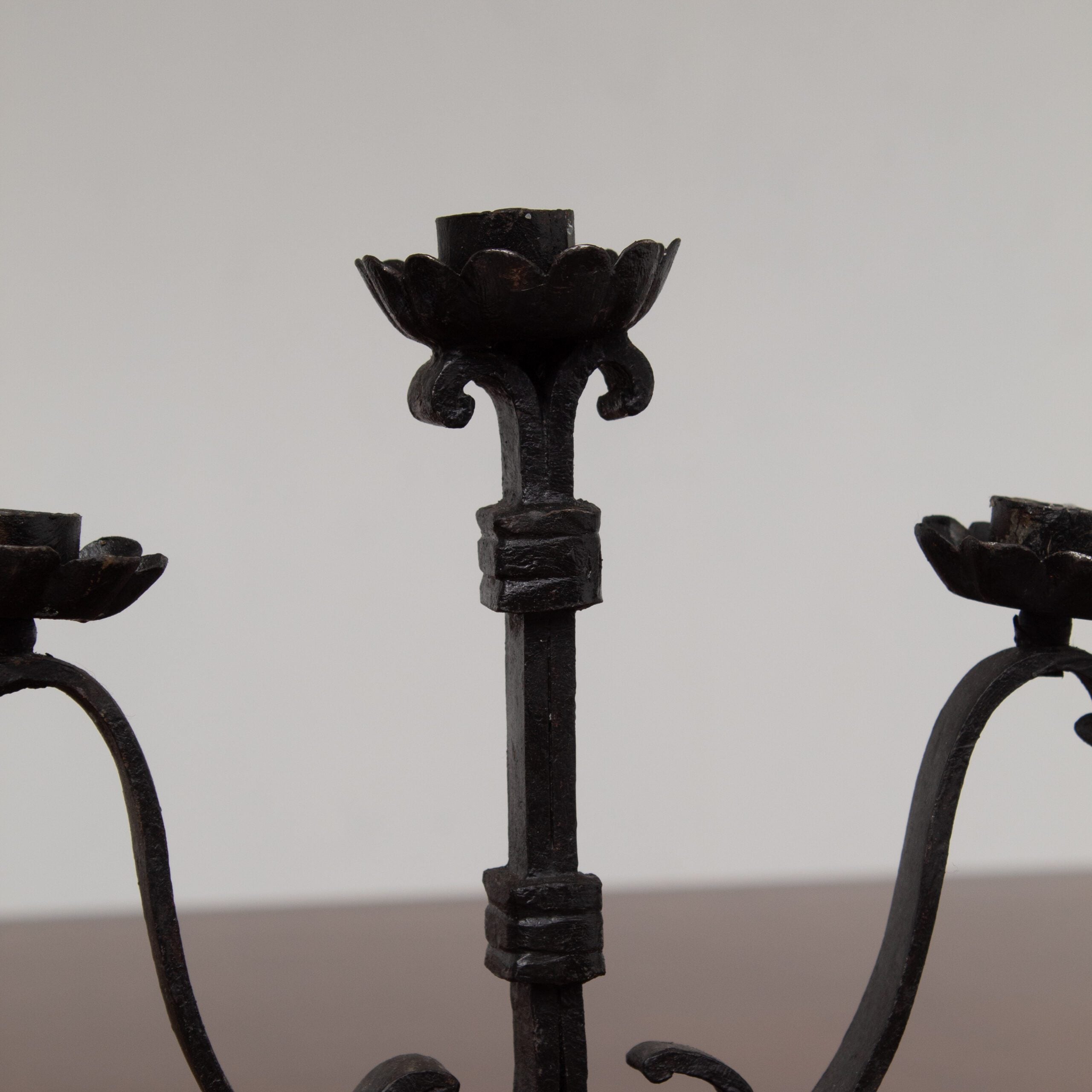 Pair of Brutalist Iron Candleholders with Sculptural Scroll Arms — side angle