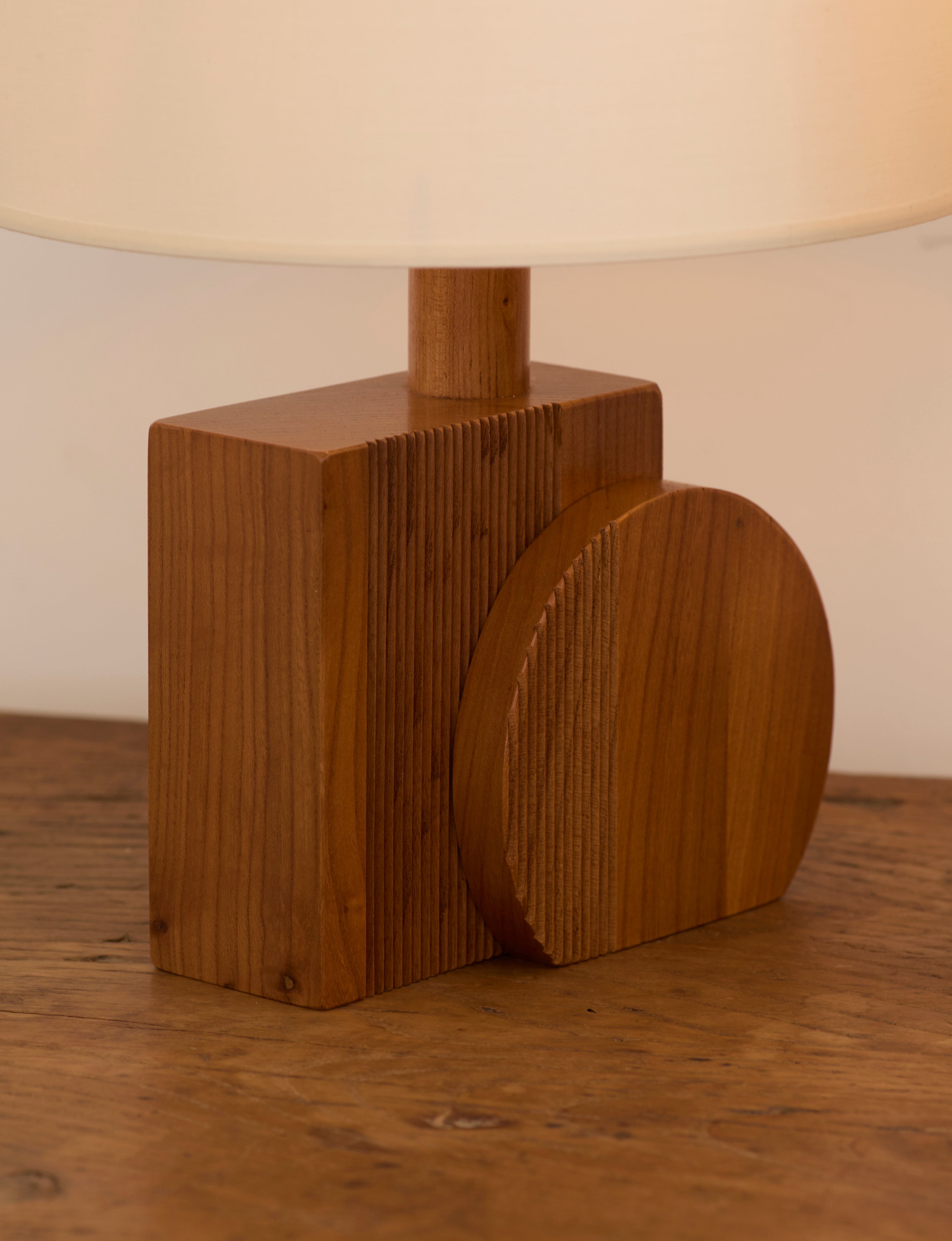 Set of 2 Vintage Artisanal Table Lamps In Solid Wood From France c. 1970 — side angle showing round wooden base detail