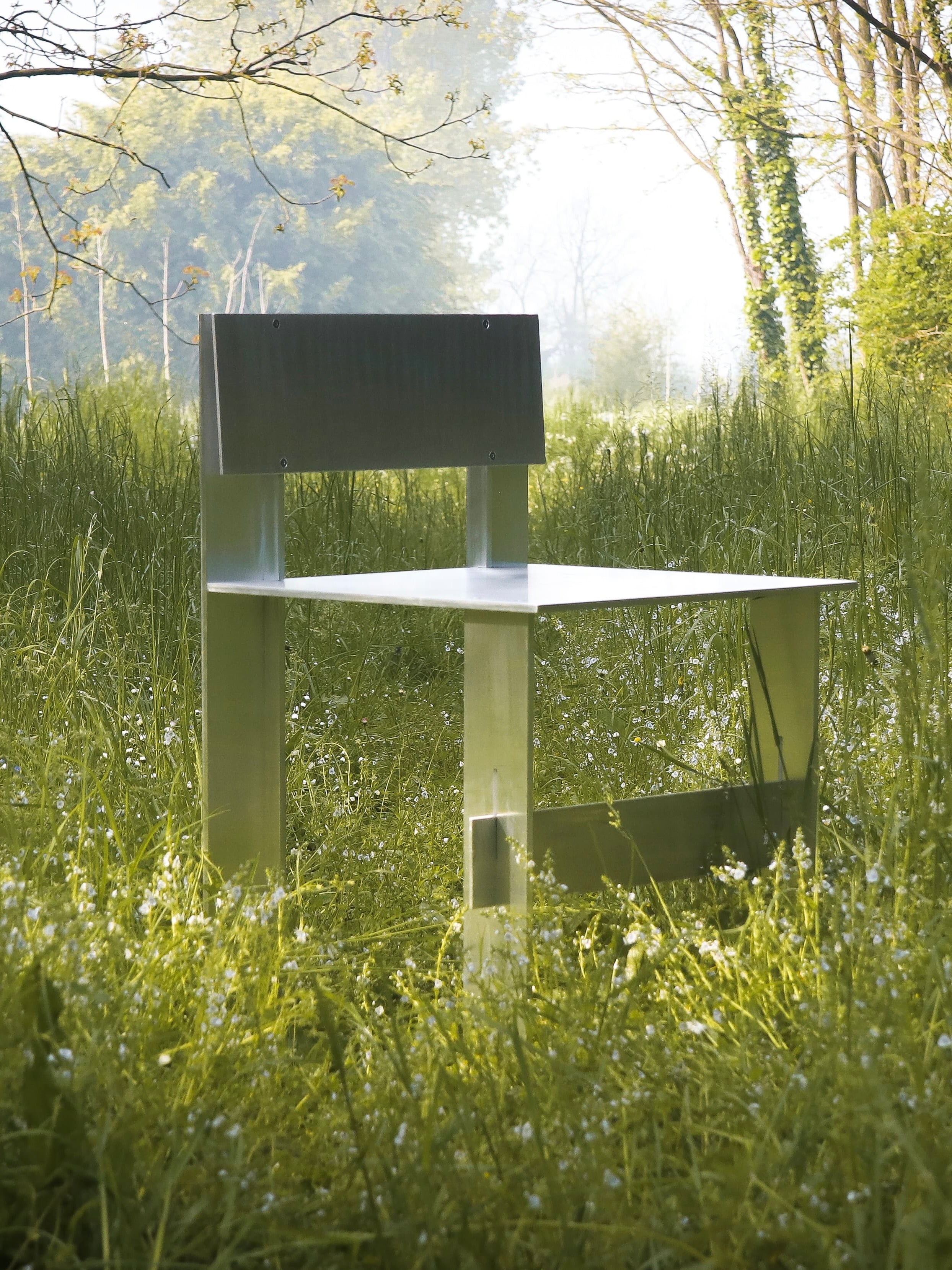 AL Chair — top view of metal seat in grassy outdoor setting
