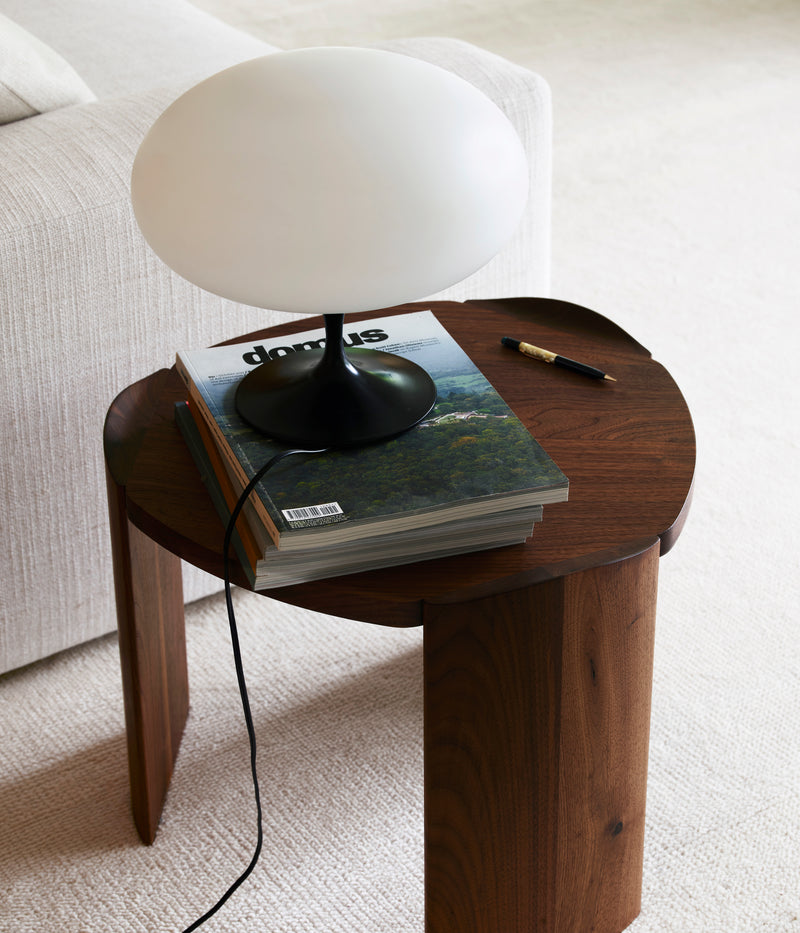 Pryn walnut end table with mushroom lamp and magazine styling