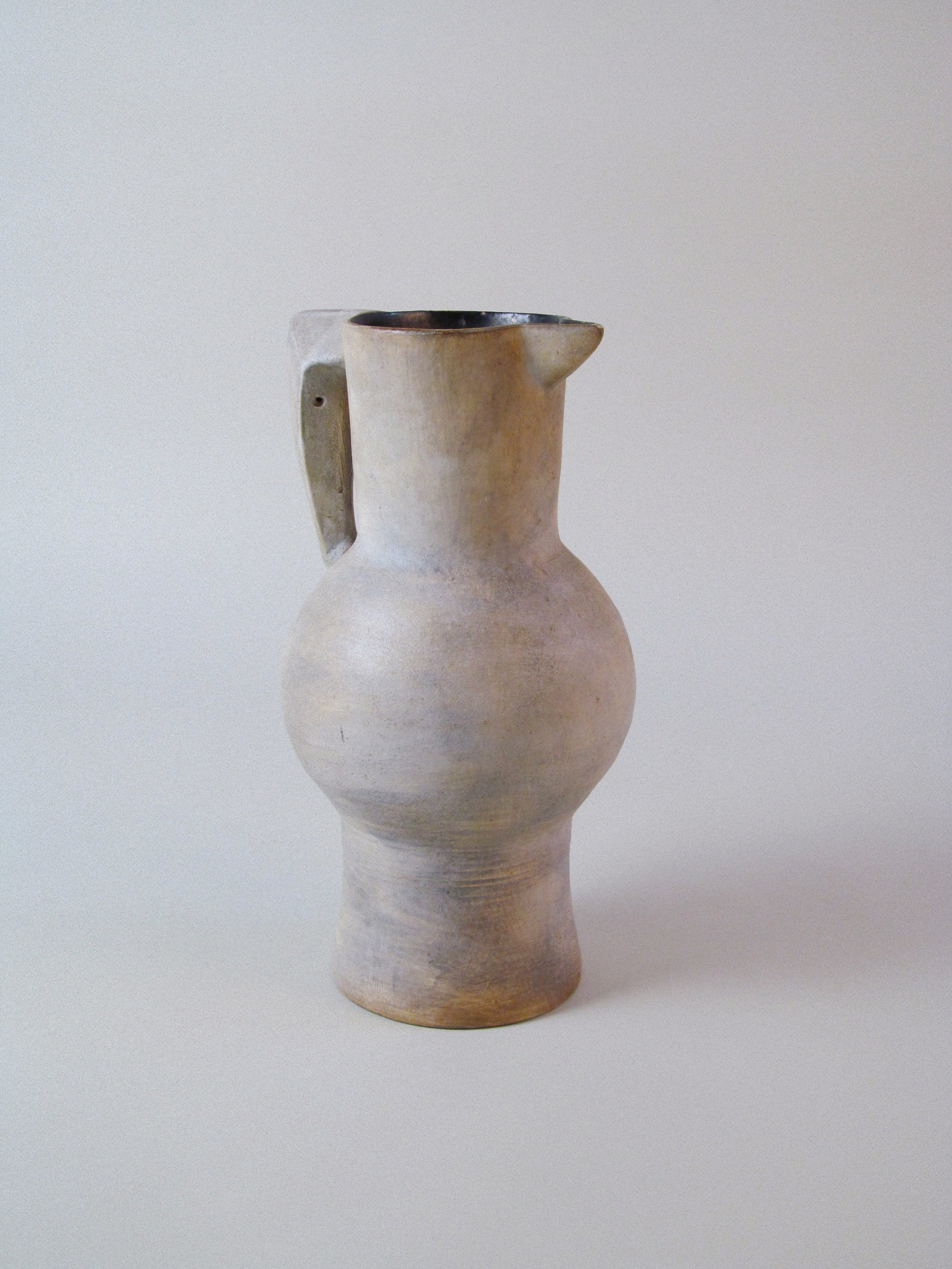 Stoneware Pitcher — side view highlighting textured surface and shape