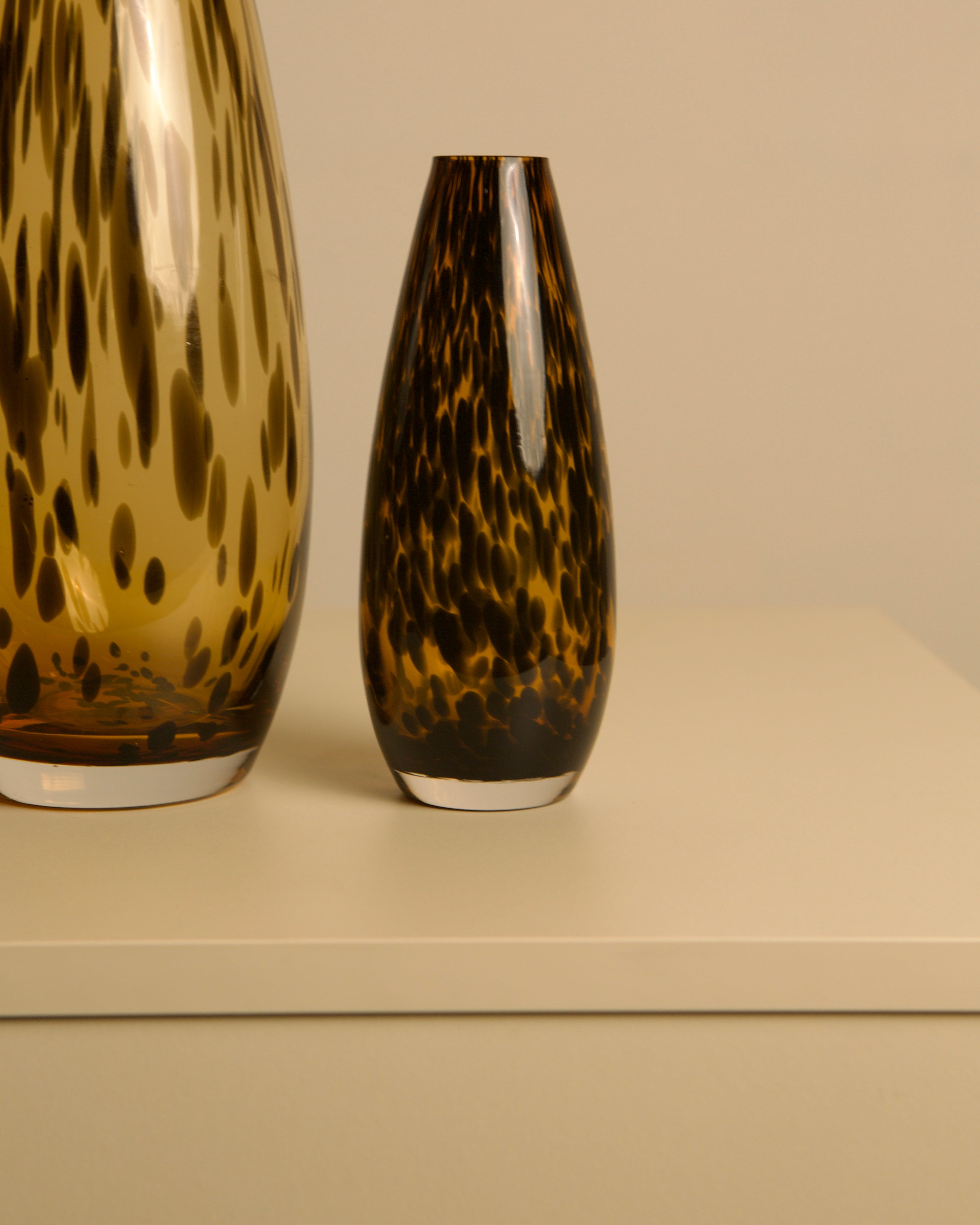 Pair of "Leopard" Murano Glass Vases from the 1980s — side angle on neutral background