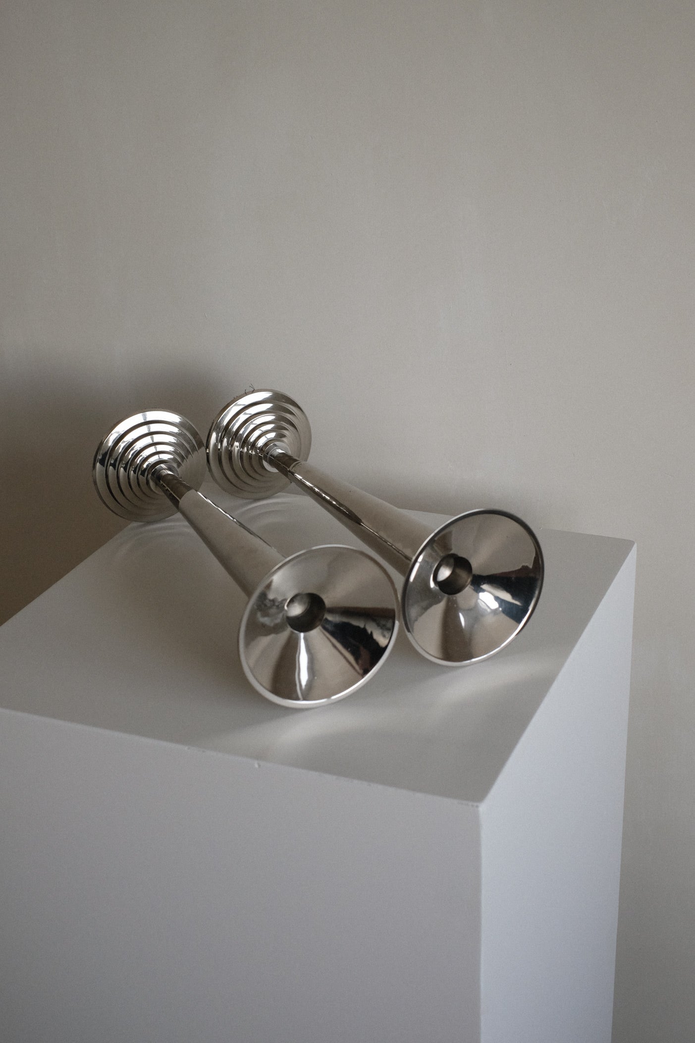 Art Deco Candle Holders — close-up of polished silver surface