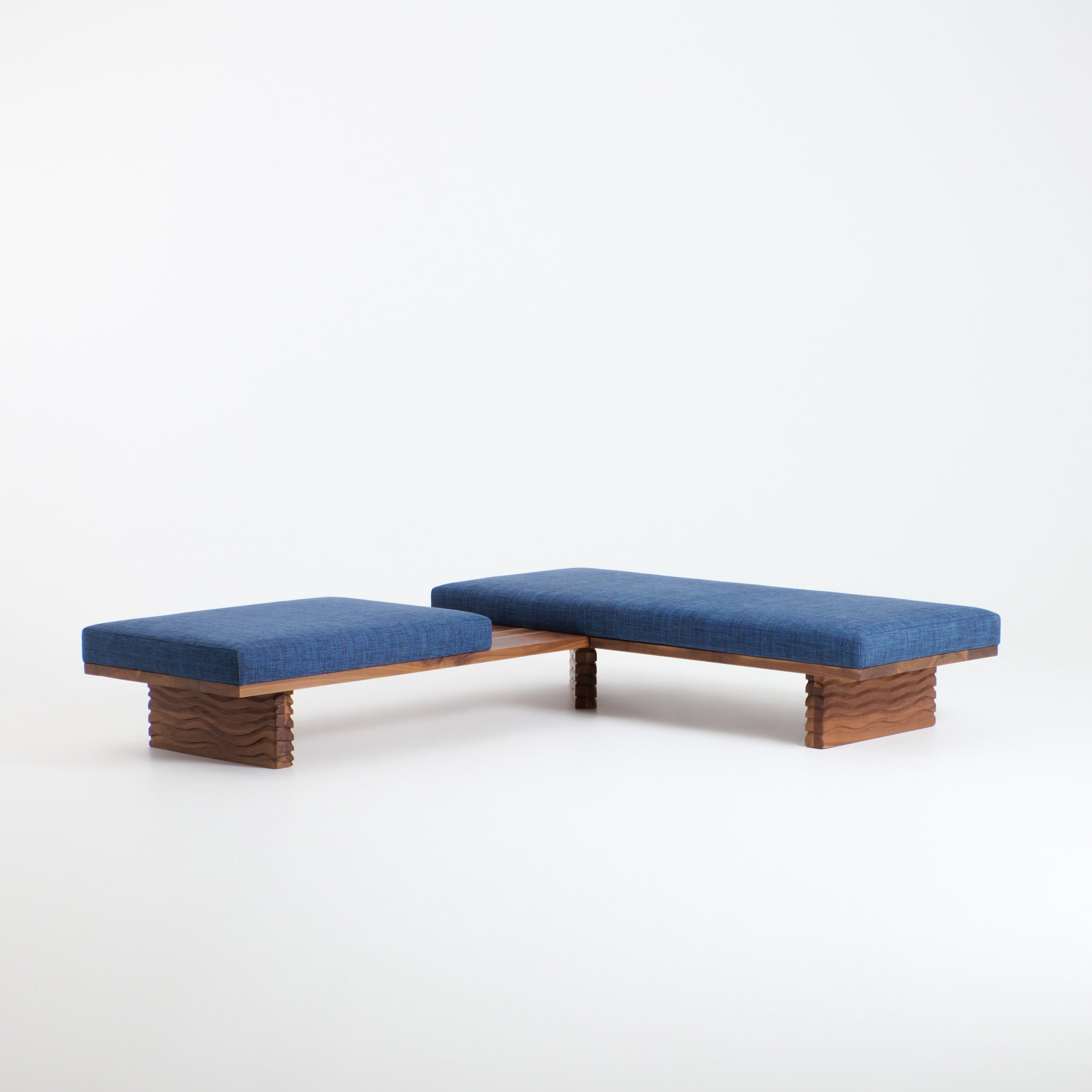 Nazaré Daybed L Shape — side angle showing blue upholstery and wooden base
