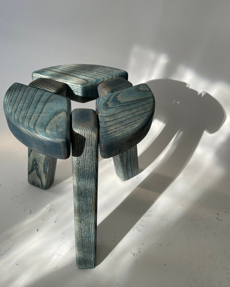 Blue-stained wood stool with curved sculptural legs by Jesse Butterfield