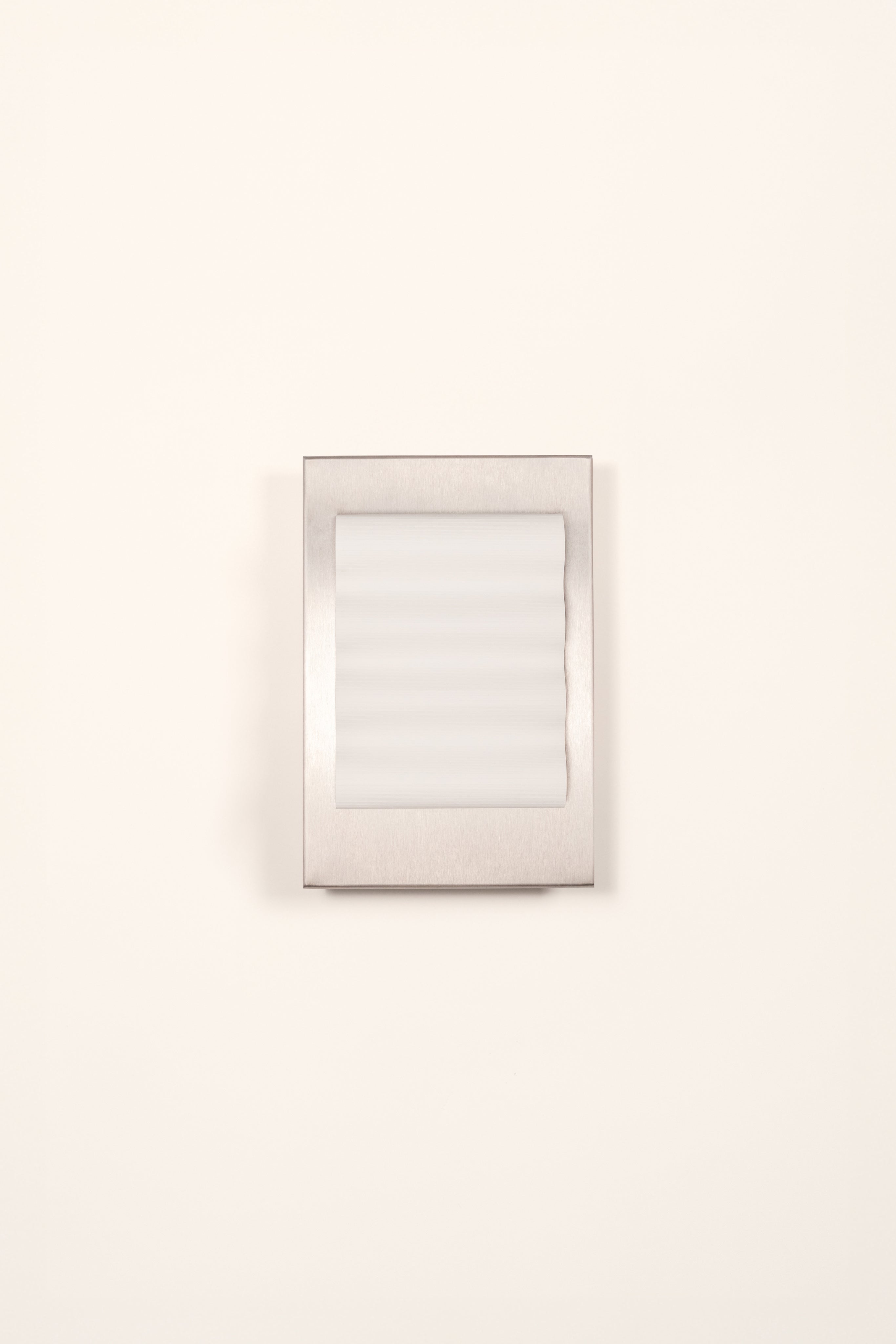 Frame" Brut S — side angle showing brushed metal finish