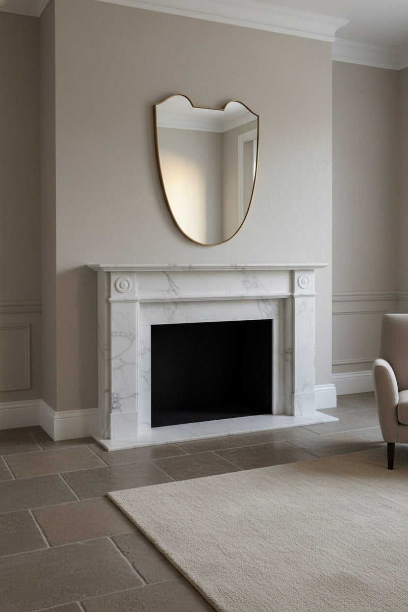 Large Midcentury Italian Brass Shield Mirror — mounted above marble fireplace
