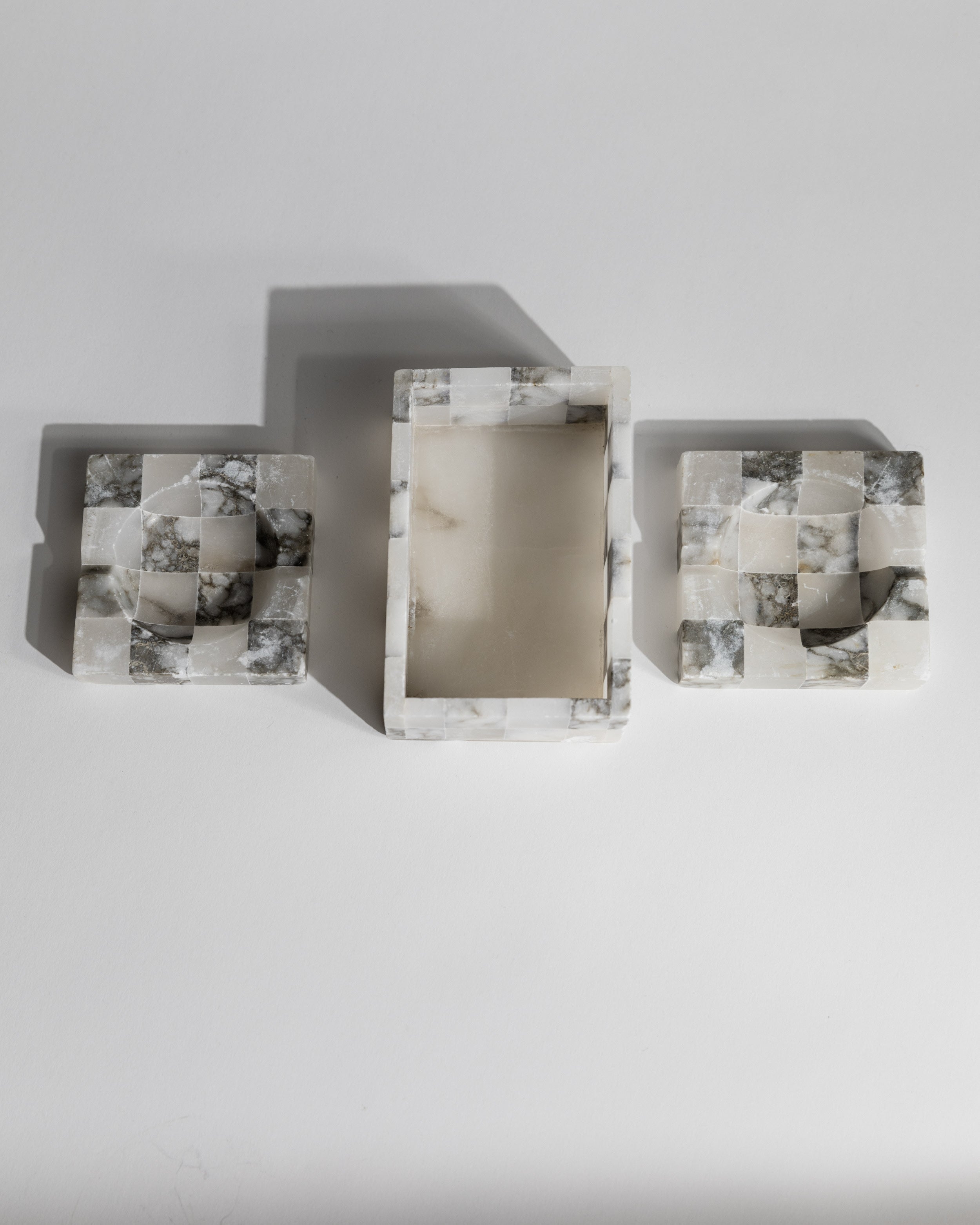 Close-up detail of 1970s marble smoking set with geometric patterns