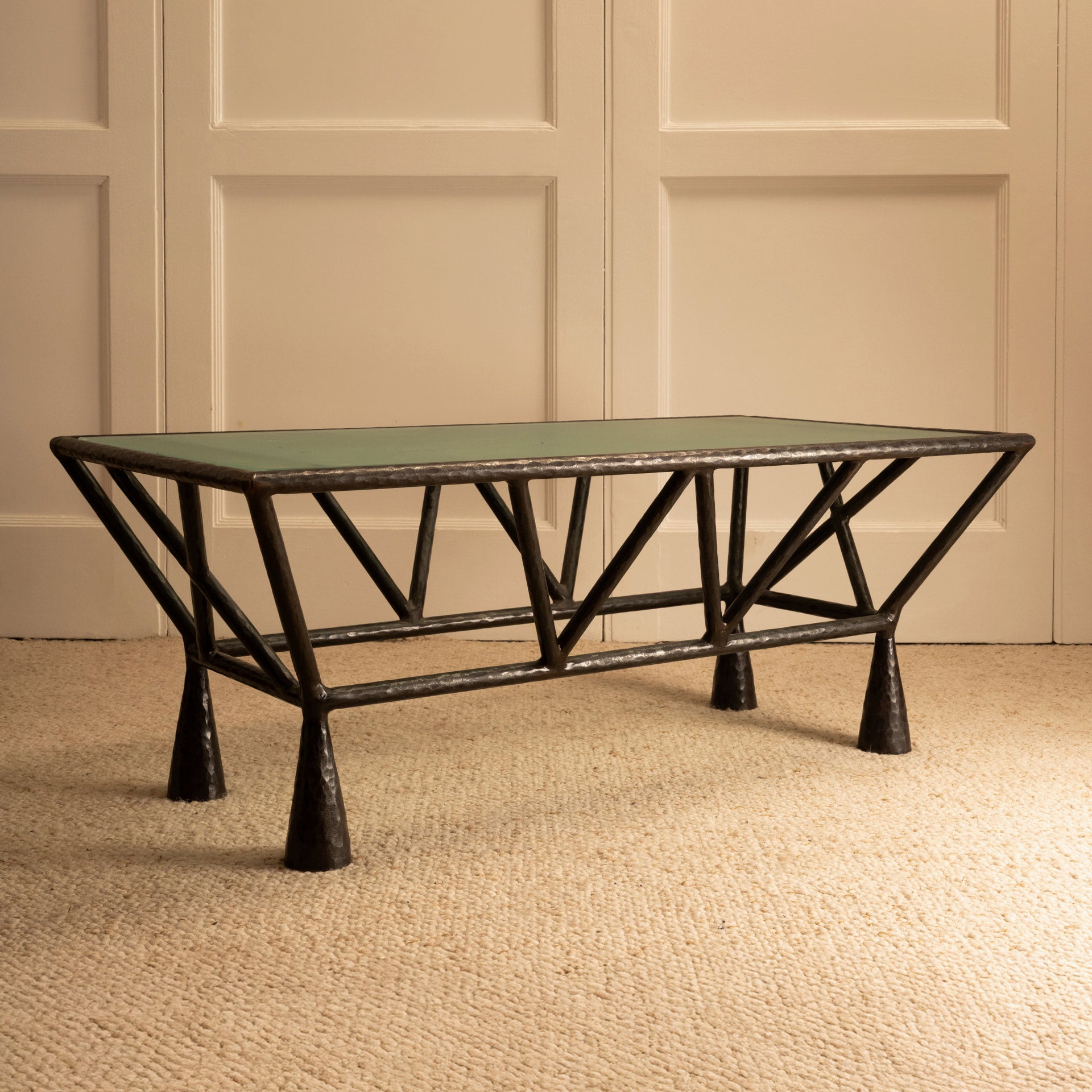 Zebra Coffee Table — angled view highlighting green glass top and metal base