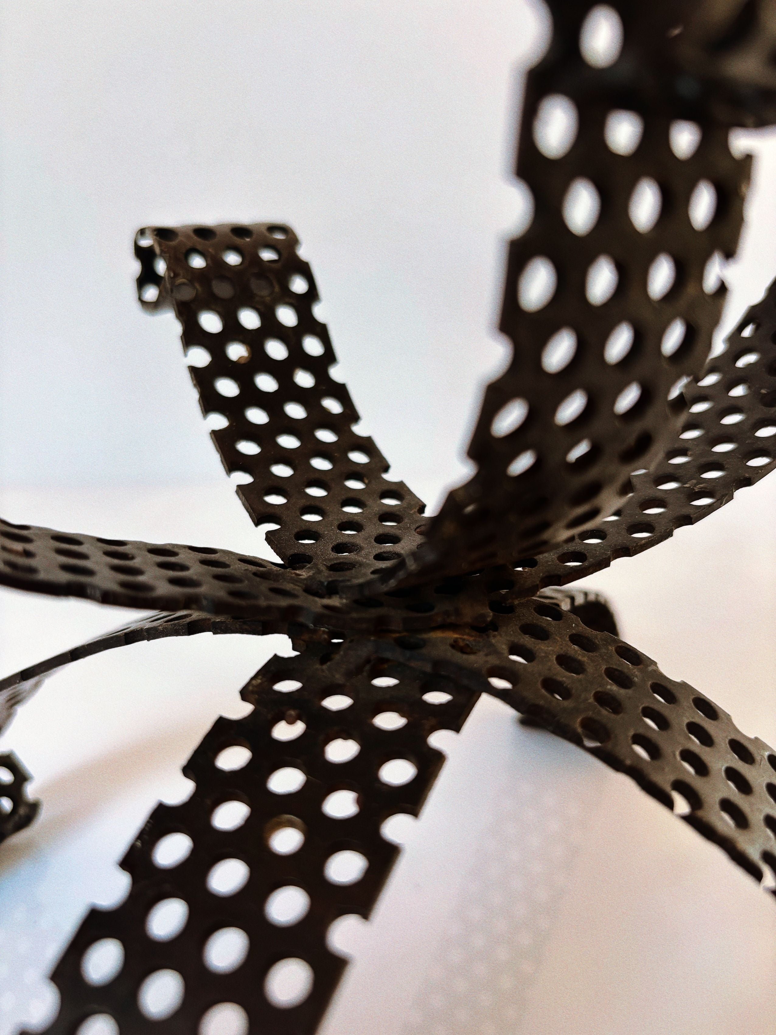 Handmade Metal 3 Arm Candleholder, Poland — side angle showing perforated metal design