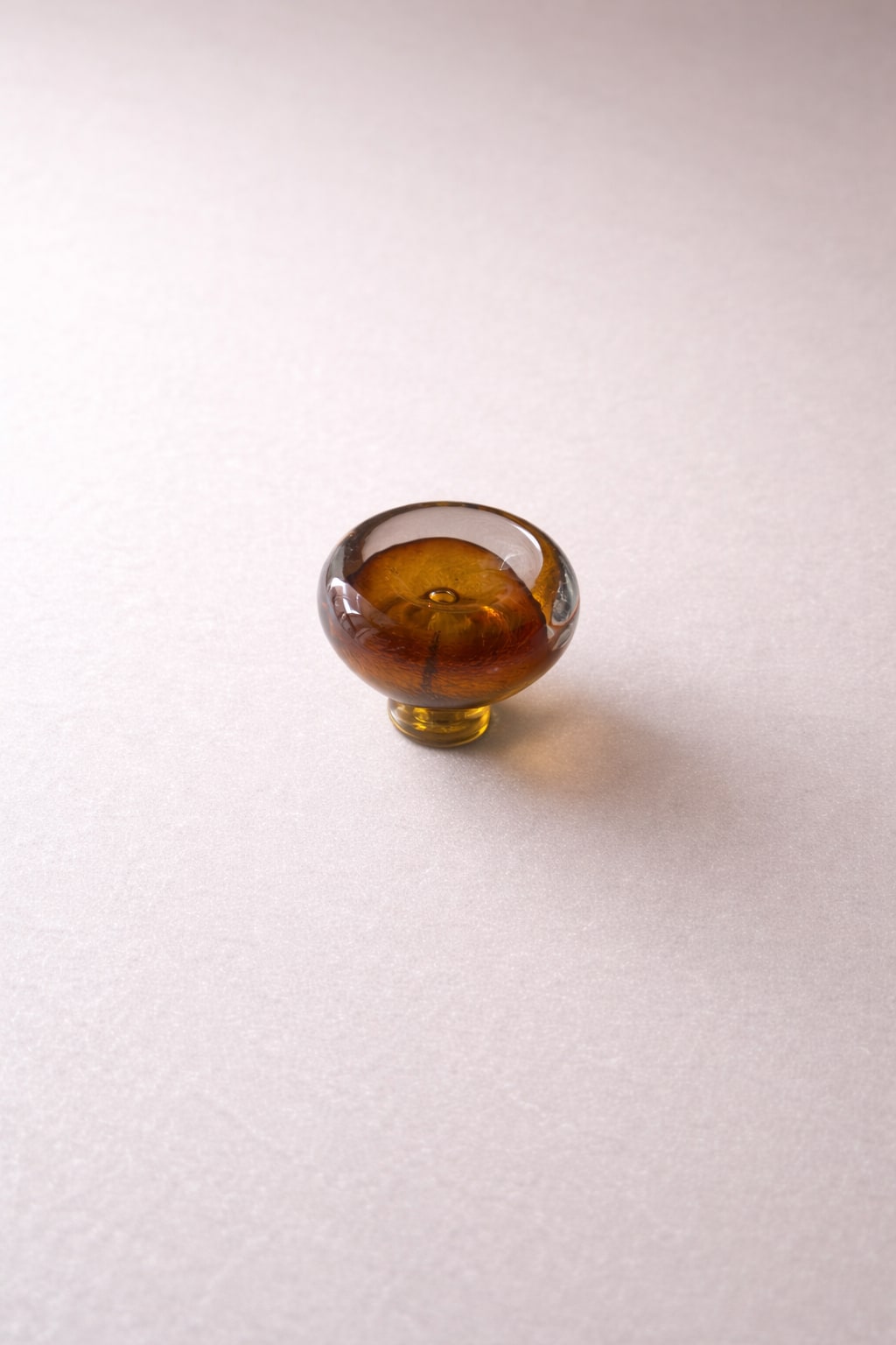 Knob Collection Sculptures in Glass — side angle of amber glass sculpture