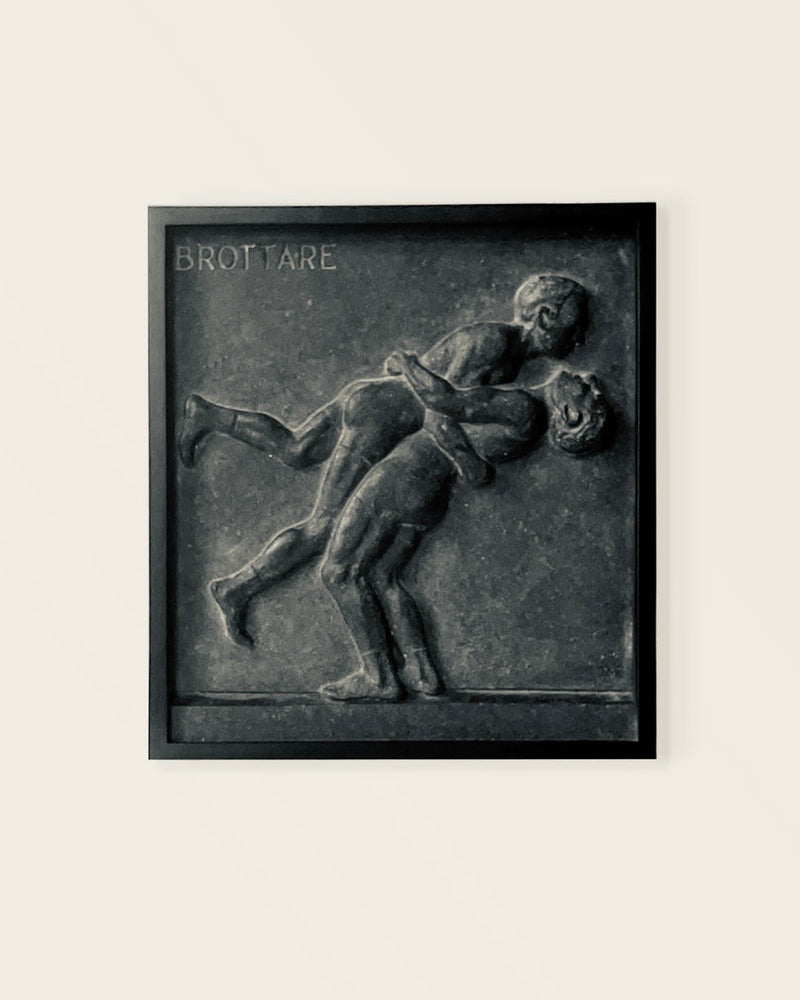 Wrestlers, Relief Sculpture in Stone — close-up of dark stone texture