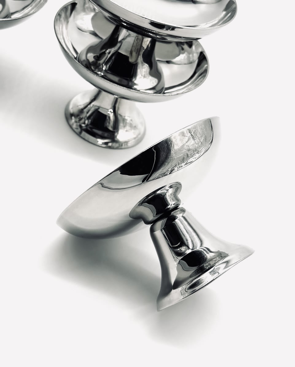 Stainless Steel Ice Coupes Set of Six — close-up of polished metal surface