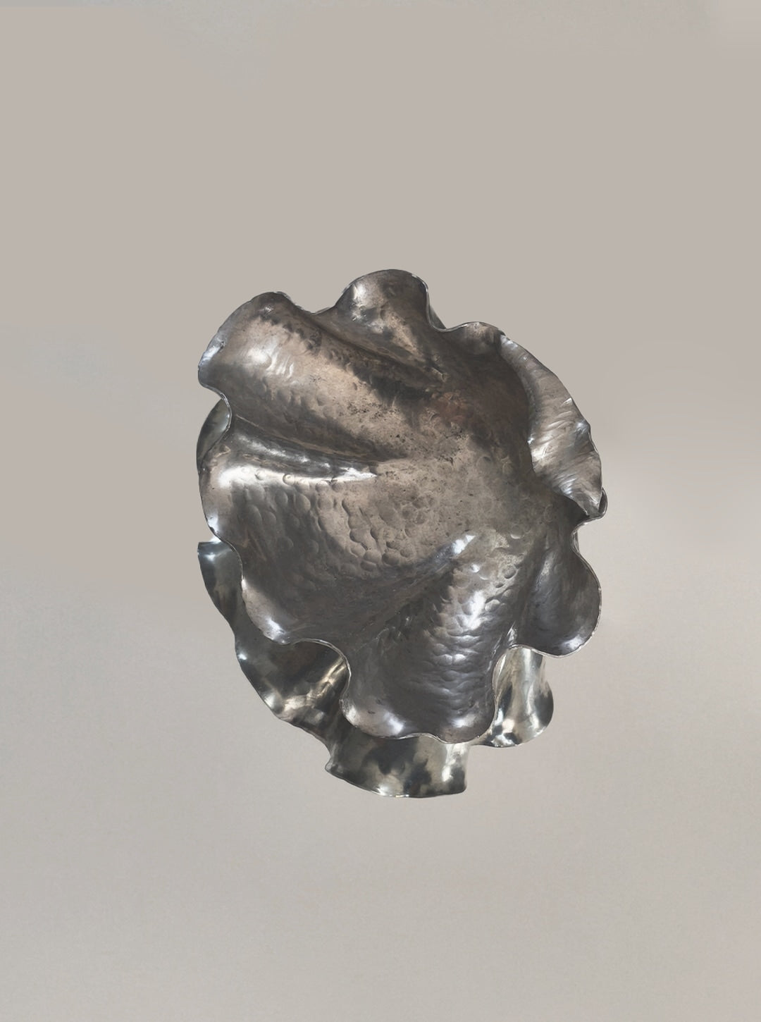 Pewter shell vide poche with ruffled edges and hammered texture