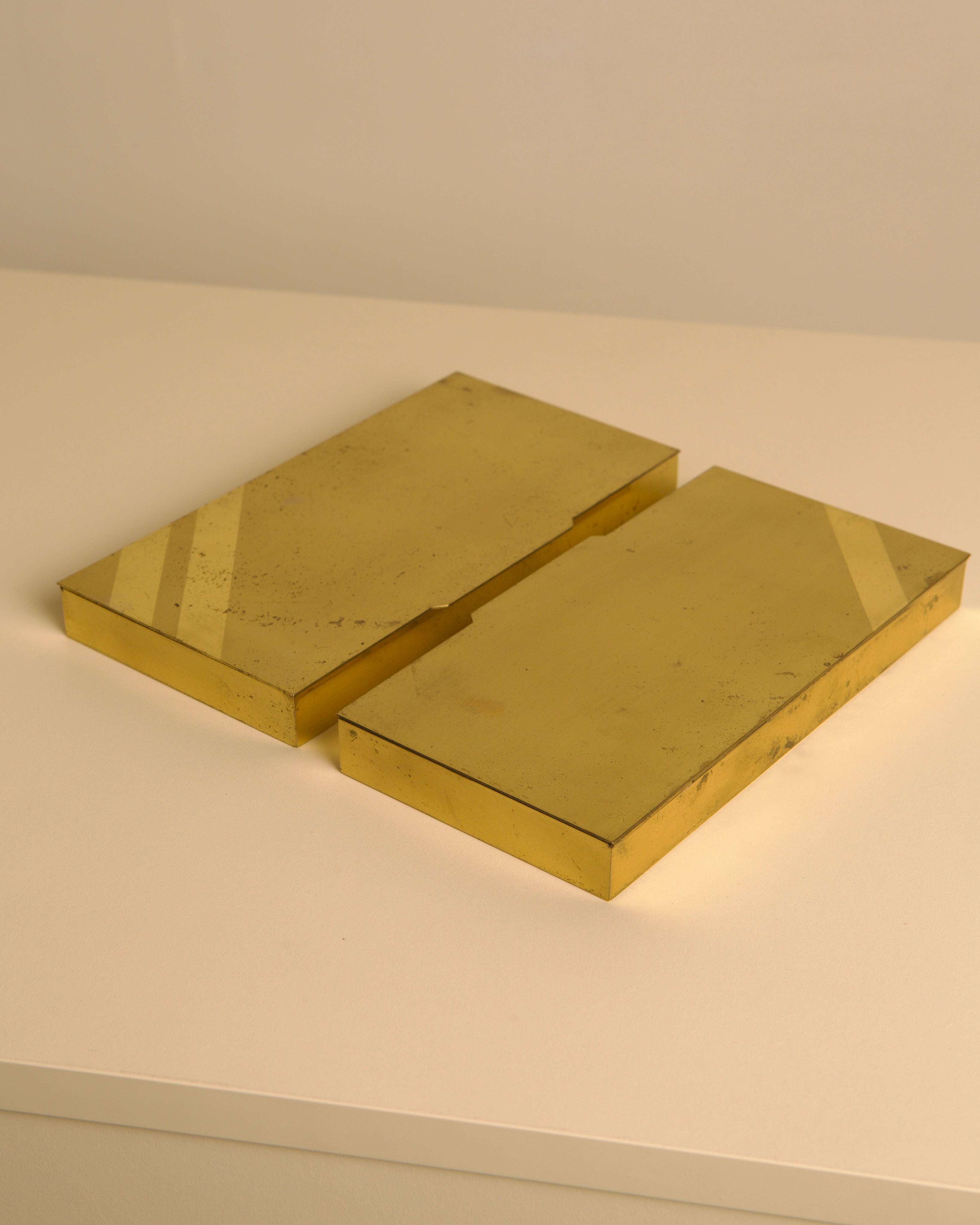 Two golden brass Italian decorative boxes from 1960s on white surface