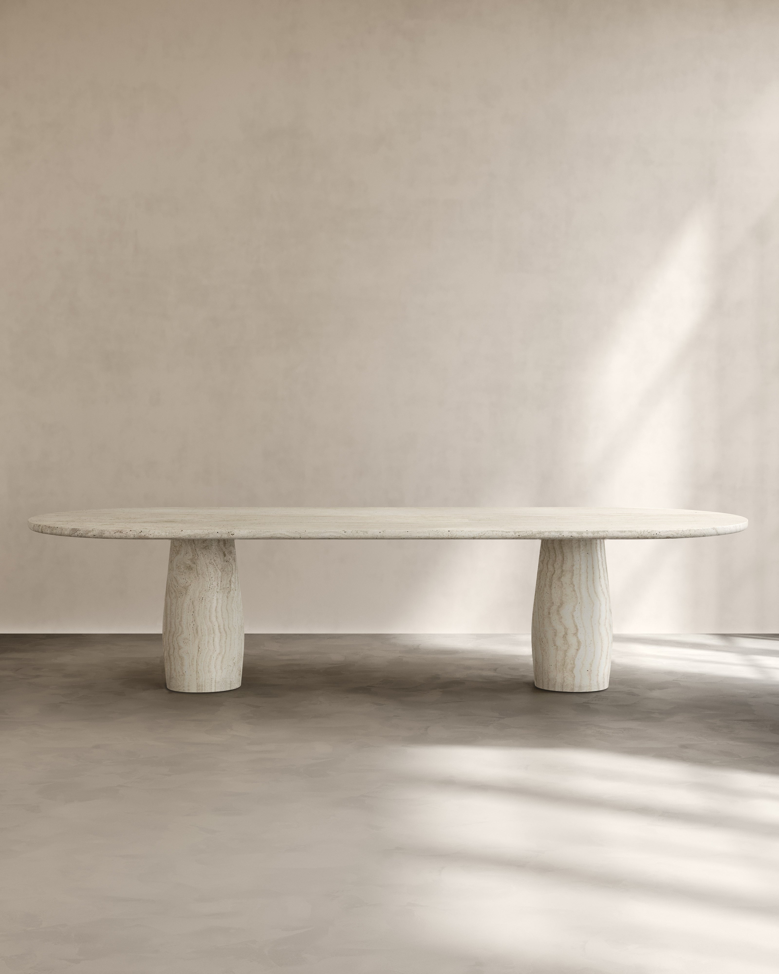 Raffaella Table IV — modern oval table with textured stone base