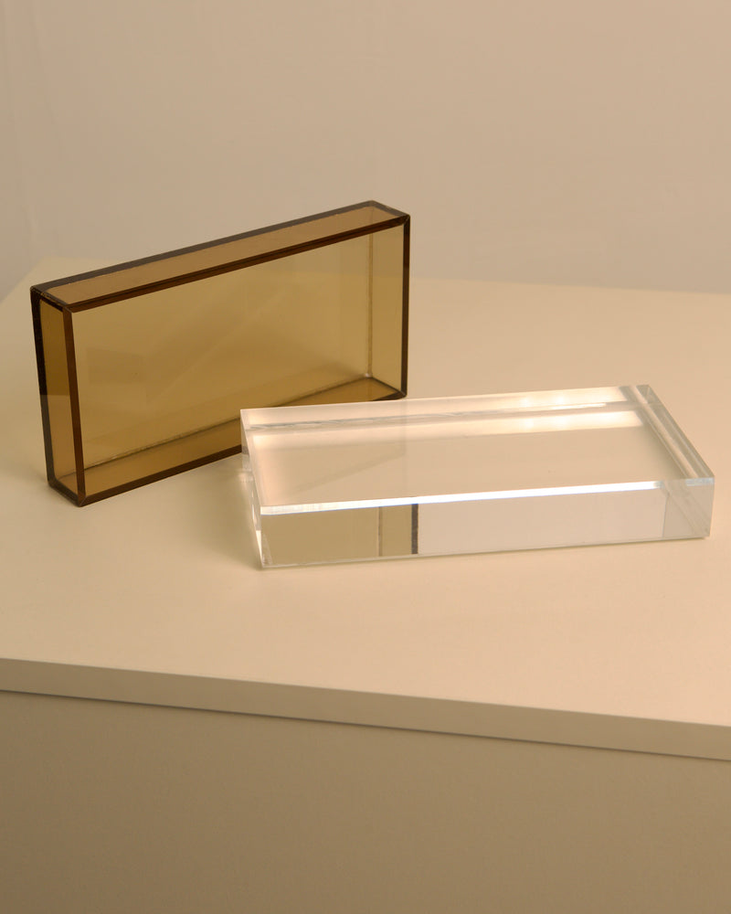 Italian plexiglass boxes showing smoked amber and clear materials