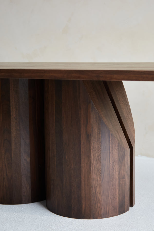 Barrow Dining Table in Solid Wood — angled view of curved wooden base