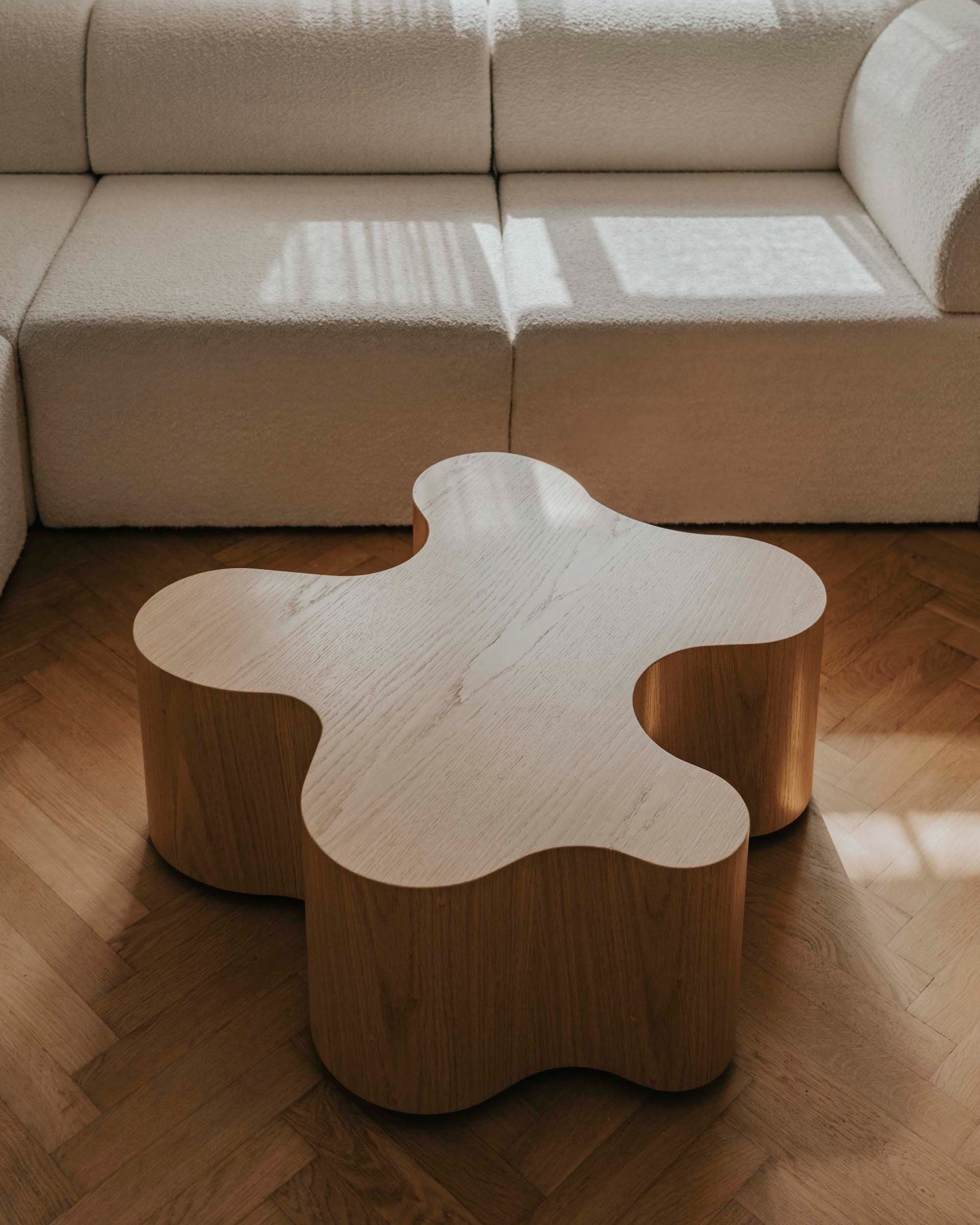 Organic-shaped oak coffee table with curved sculptural base